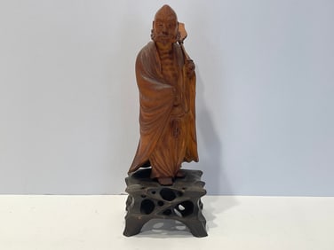CARVED WOODEN FIGURE