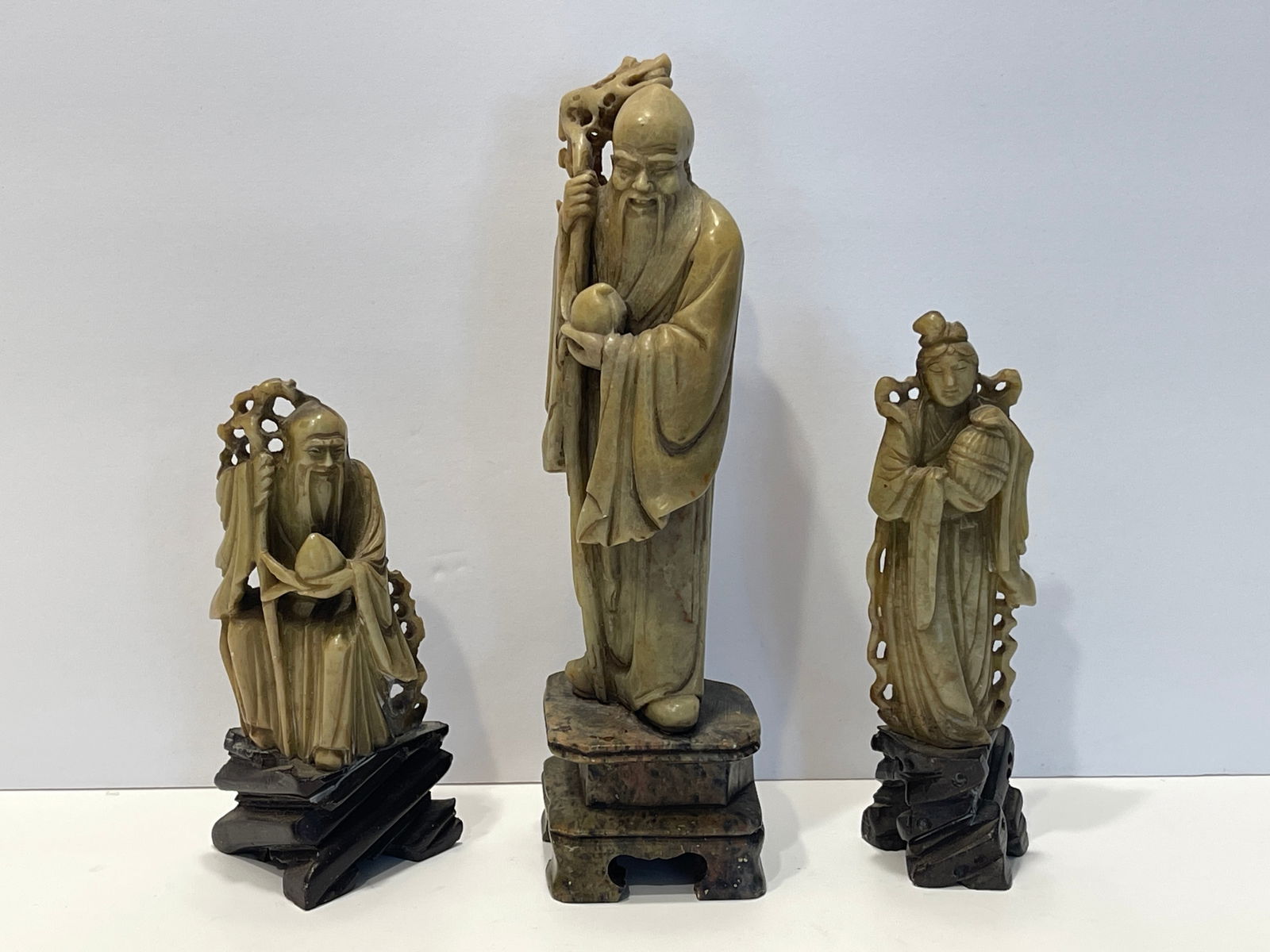 THREE CARVED FIGURES (1 of 2)