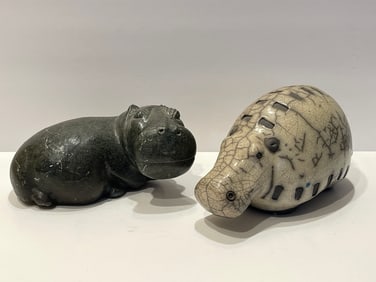TWO CARVED STONE HIPPOS