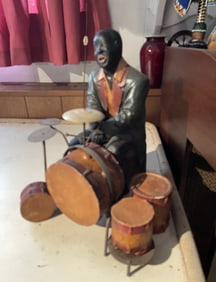 DECORATIVE MAN PLAYING DRUMS
