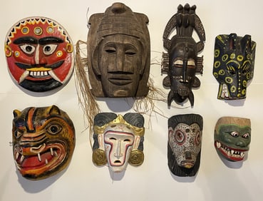 EIGHT PAINTED CARVED MASKS