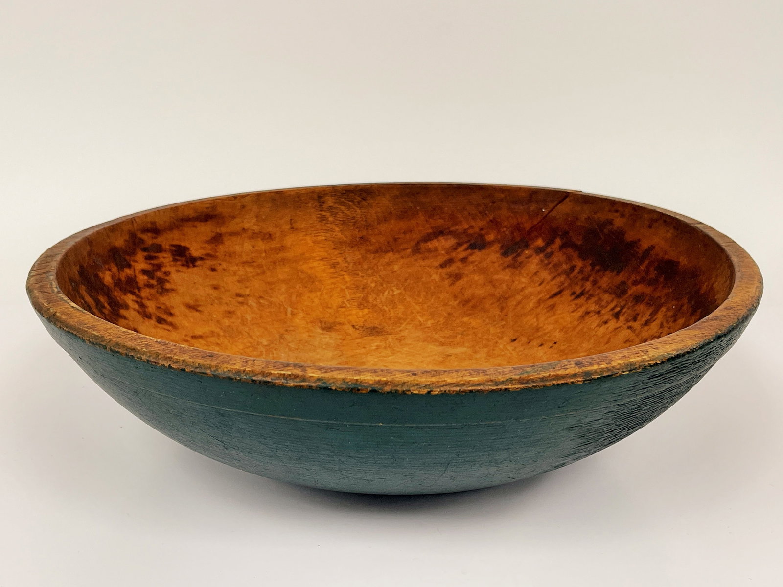 14?? WOODEN DOUGH BOWL IN OLD GREEN PAINT. WITH APPROPRIATE SHRINKAGE. CONDITION COMMENSURATE WITH: 14” Wooden Dough Bowl in Old Green Paint. With appropriate shrinkage. Condition commensurate with age and use.