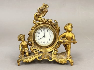 BRONZE CLOCK WITH CHERUBS