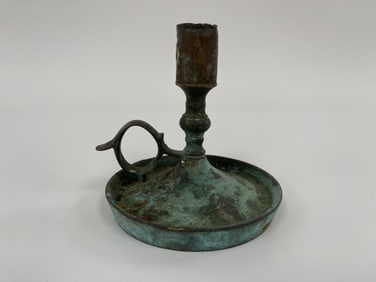 EARLY 17TH C ROUND BASE , BRASS CANDLESTICK IN THE CROMWELLIAN STYLE