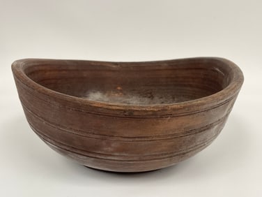 WELL WORN , AGE MISSHAPEN , WOODEN BOWL IN RED PAINT