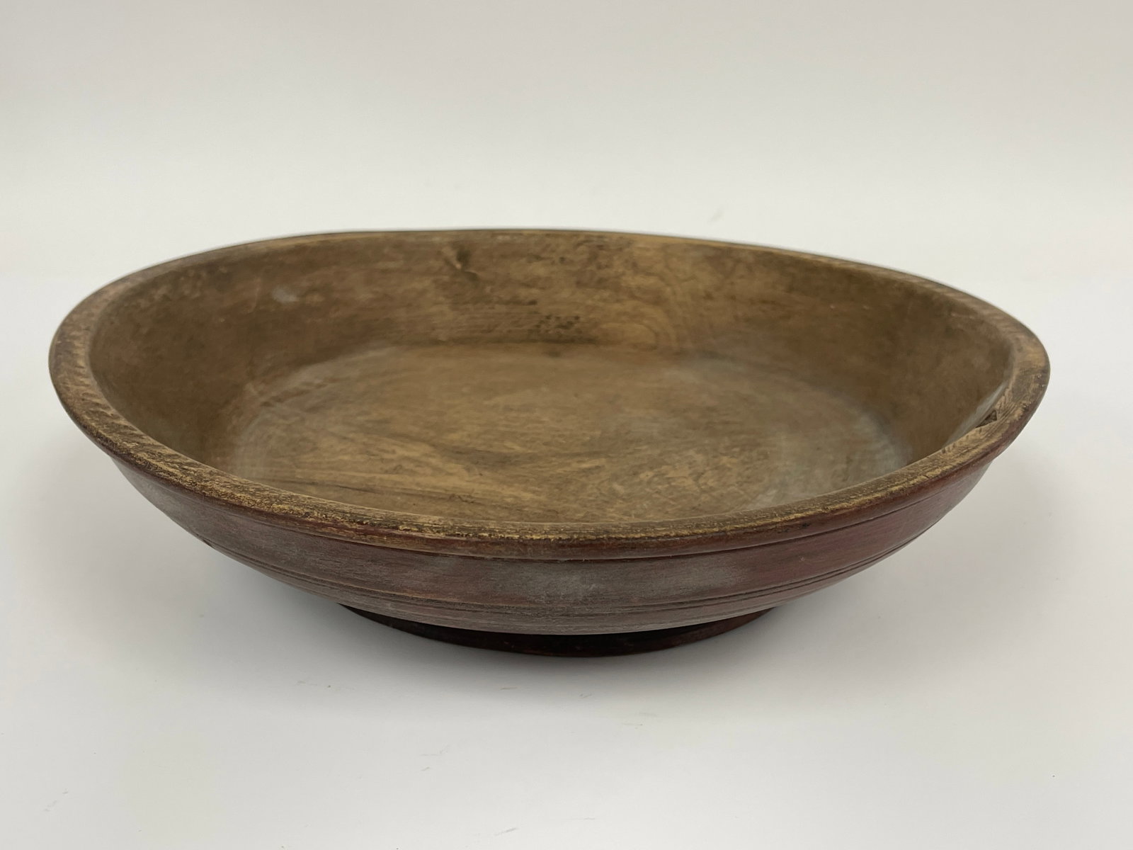 EARLY SHALLOW BOWL IN WELL WORN RED PAINT: EARLY SHALLOW BOWL IN WELL WORN RED PAINT 14" X 4"