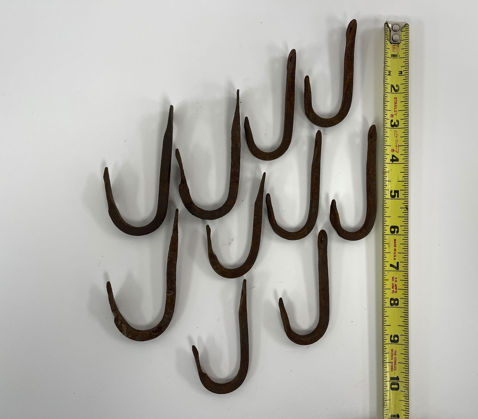 GROUP OF TEN FORGED IRON IMPLEMENT HOOKS (1 of 1)