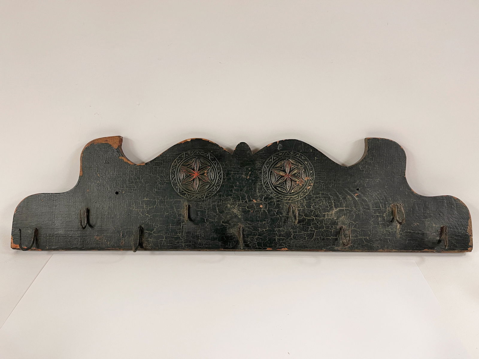 PINWHEEL CARVED BOARD WITH FORGED GAME HOOKS IN WORN OLD GREEN PAINT (1 of 4)