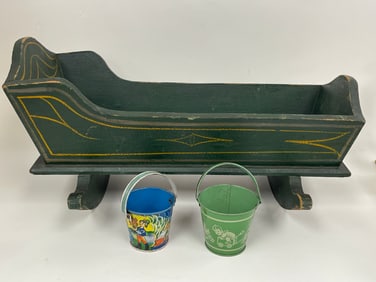 LOT OF 2:  a.        pair mini tin sand pails b.        19th c doll cradle in original green paint