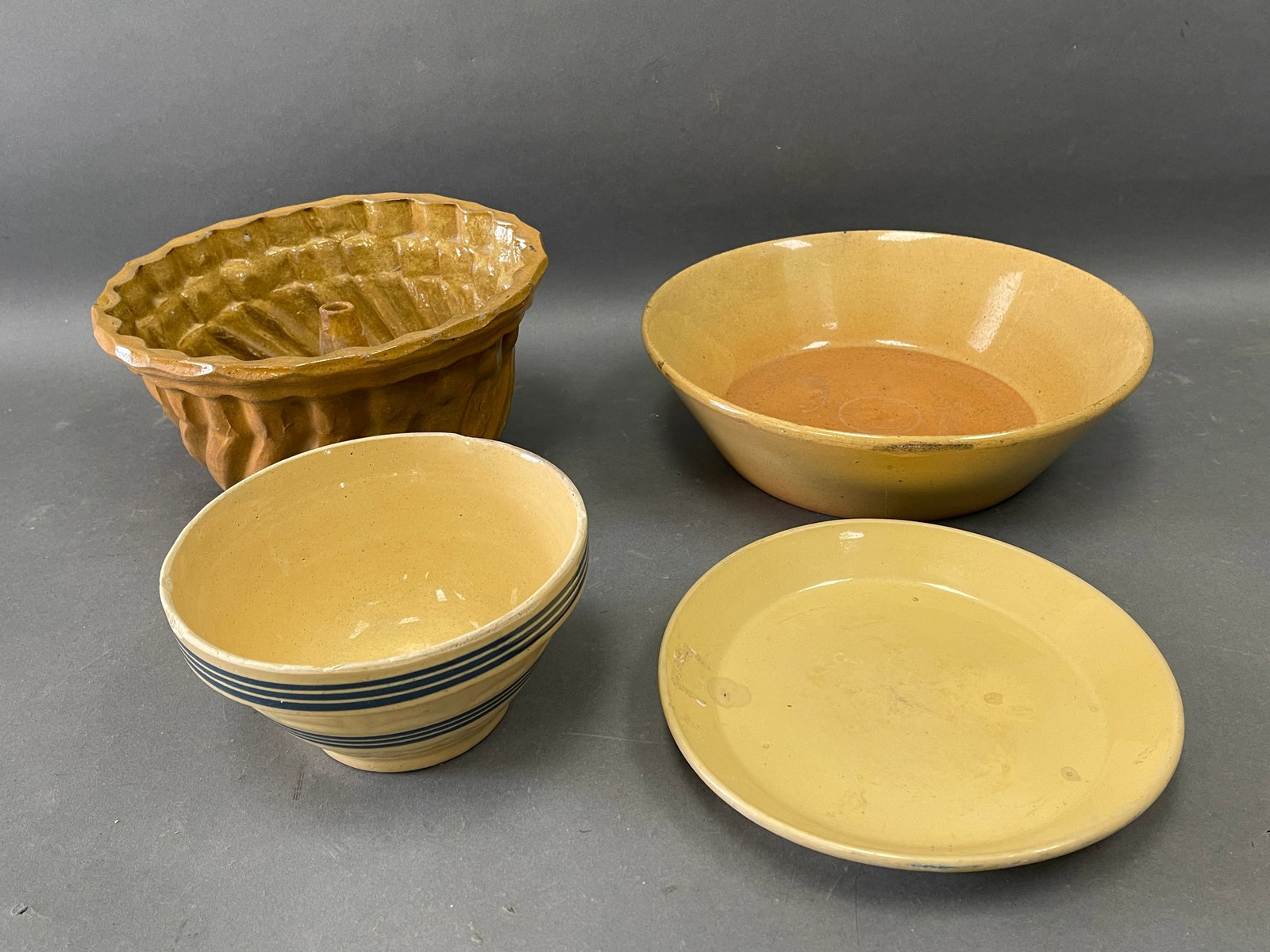 LOT YELLOWWARE: a.C1890  9?? plate   b. C1890 8?? pineapple mold  c. C1880 12?? milk pan.  d. (1 of 6)