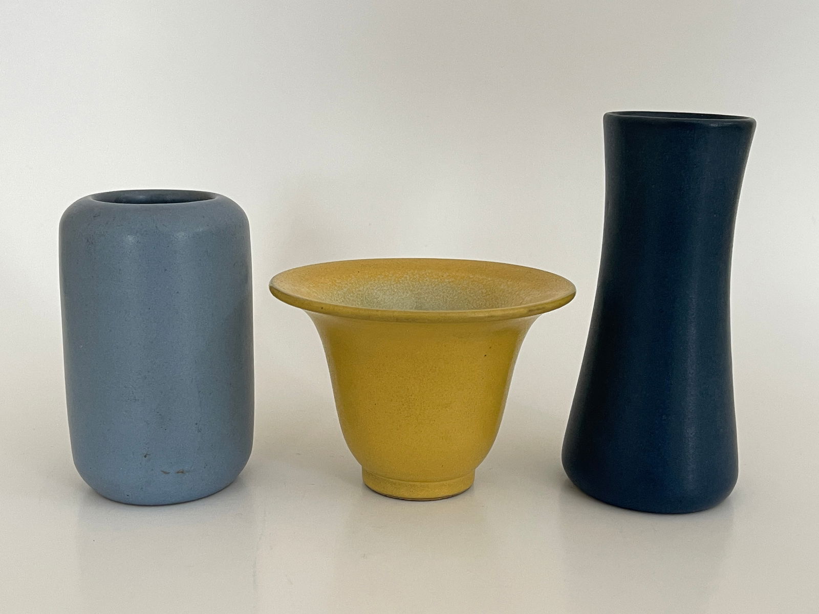 MARBLEHEAD POTTERY GROUPING, THREE PIECES: MARBLEHEAD POTTERY GROUPING, THREE PIECES, MARBLEHEAD POTTERY CATALOG #109 YELLOW 2 3/4" X 3 5/8 T, CATALOG # 103 BLUE 2" X 4 1/2" T , CATALOG #108 GRAY 2" X 3 5/8" T