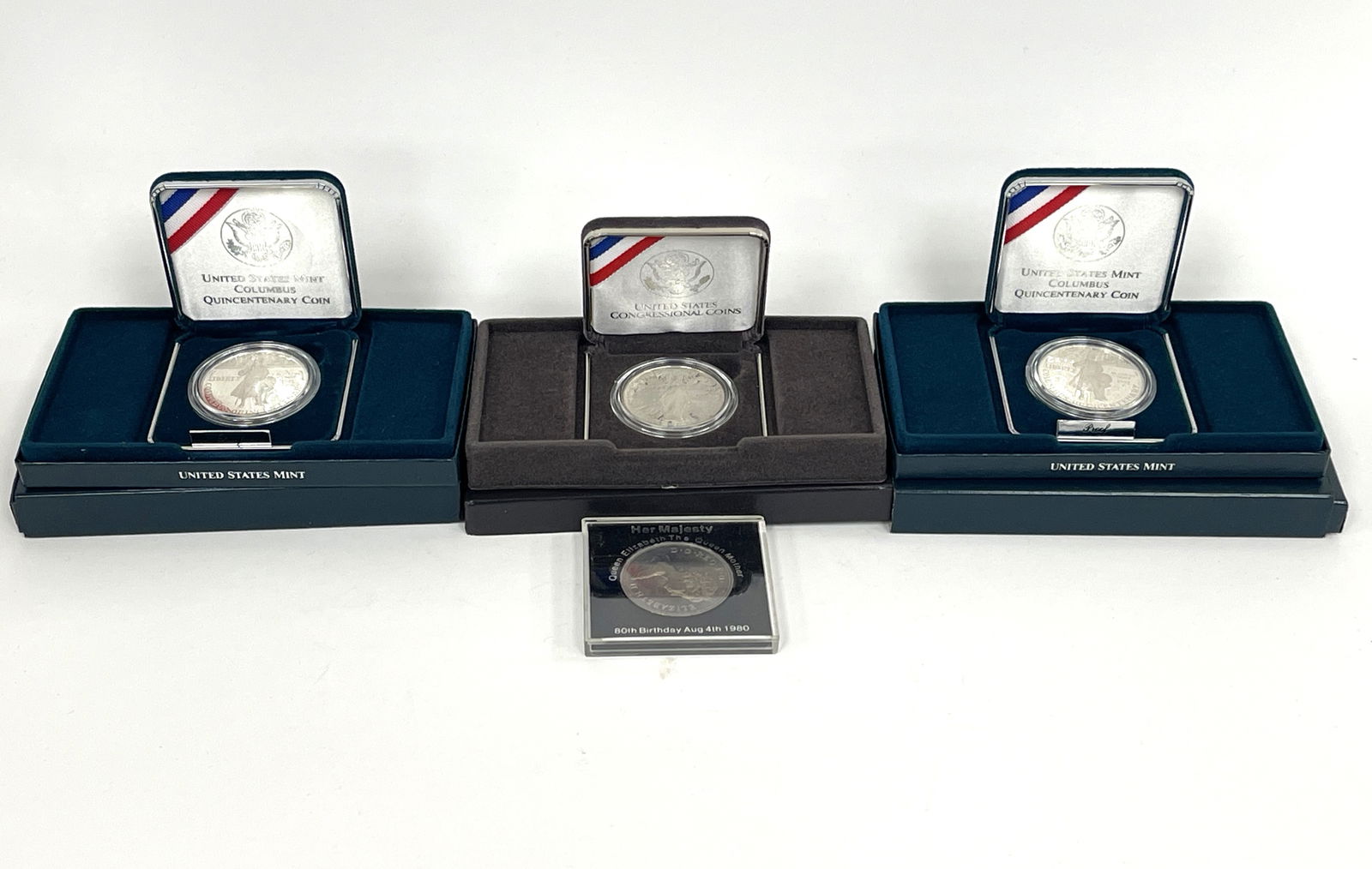 FOUR UNCIRCULATED SILVER COINS (1 of 7)