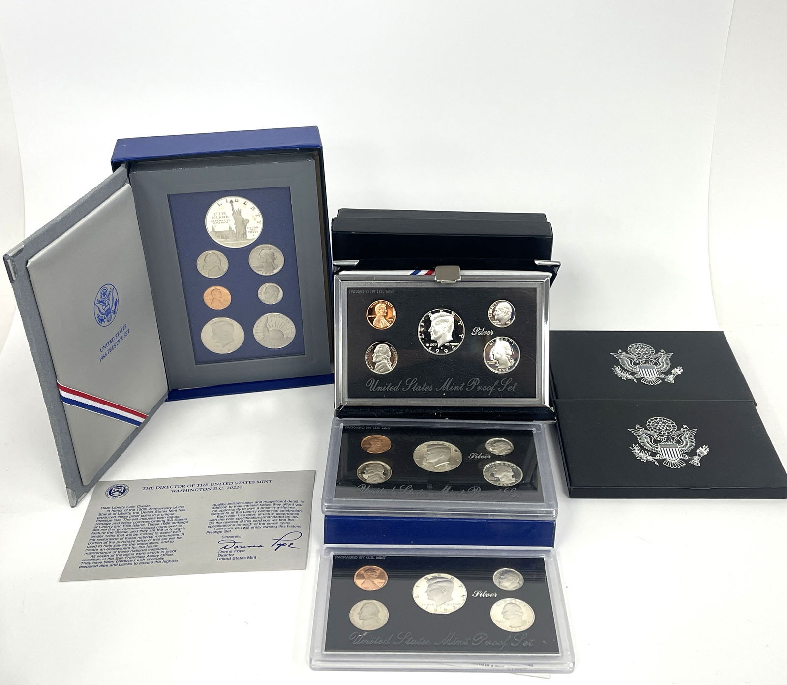FOUR US MINT COIN SETS: FOUR US MINT COIN SETS