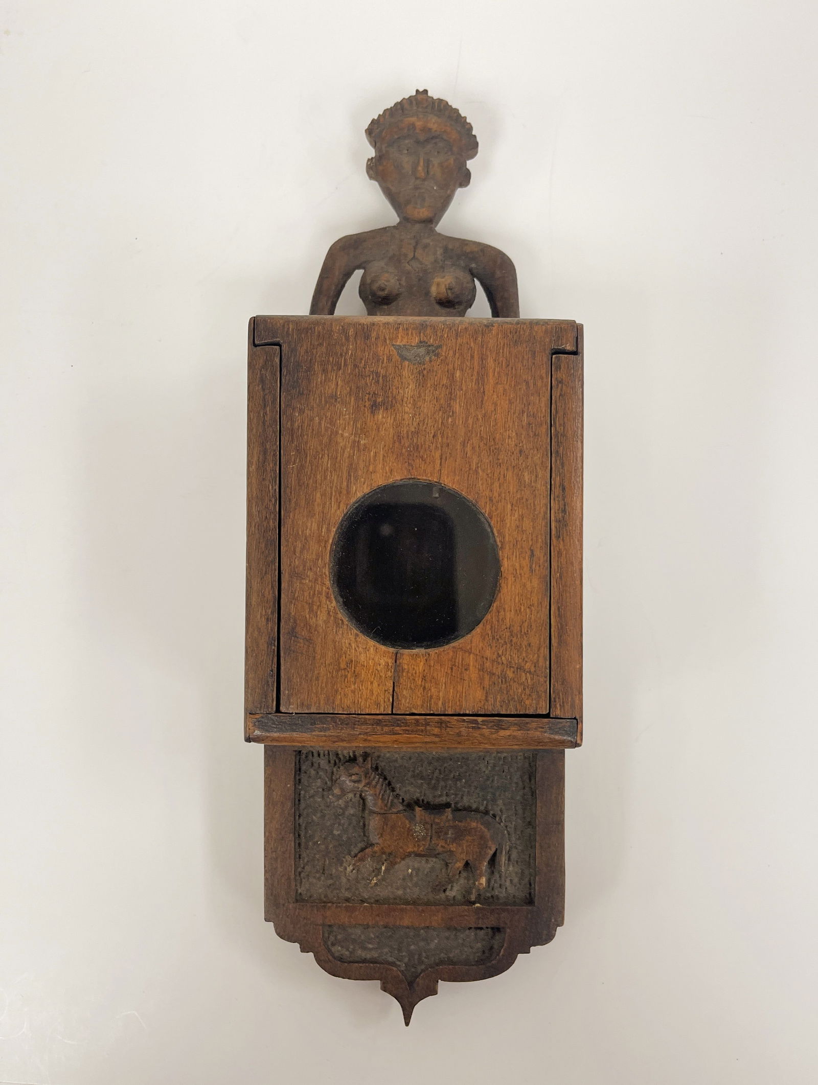 CARVED WATCH HUTCH: CARVED WATCH HUTCH Nude carved crest, relief carved horse beneath slide lid pocket watch case, walnut, early – mid 19th C, original surfaces, excellent condition.