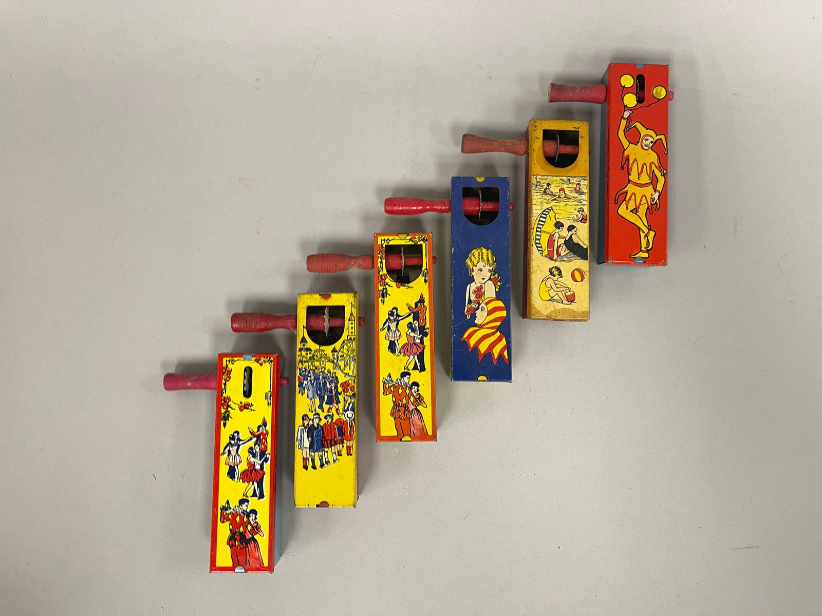 NOISEMAKERS: NOISEMAKERS Colorful designs, wood & tin, early 20th C, excellent working condition.