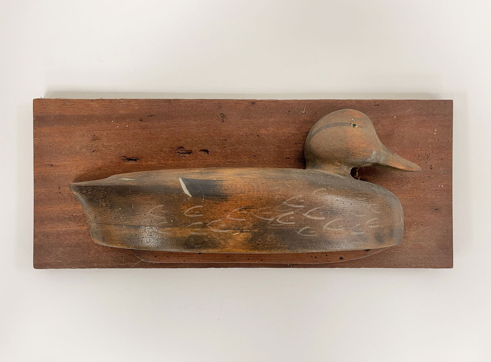 DUCK PLAQUE: DUCK PLAQUE Half round carving, mounted, original surfaces, mid 20th C, excellent condition.