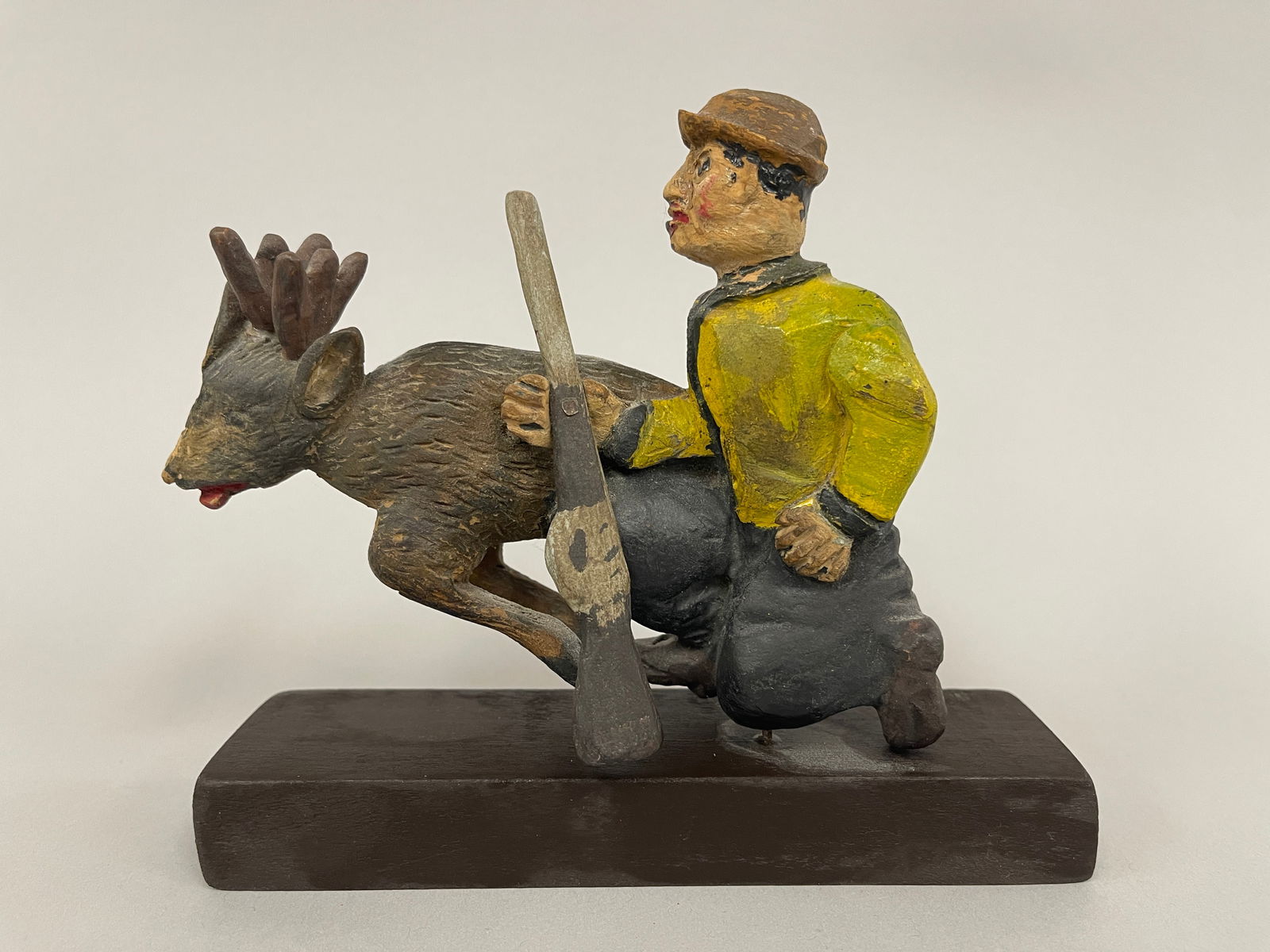 CARVED HUNTER WITH DEER (1 of 4)