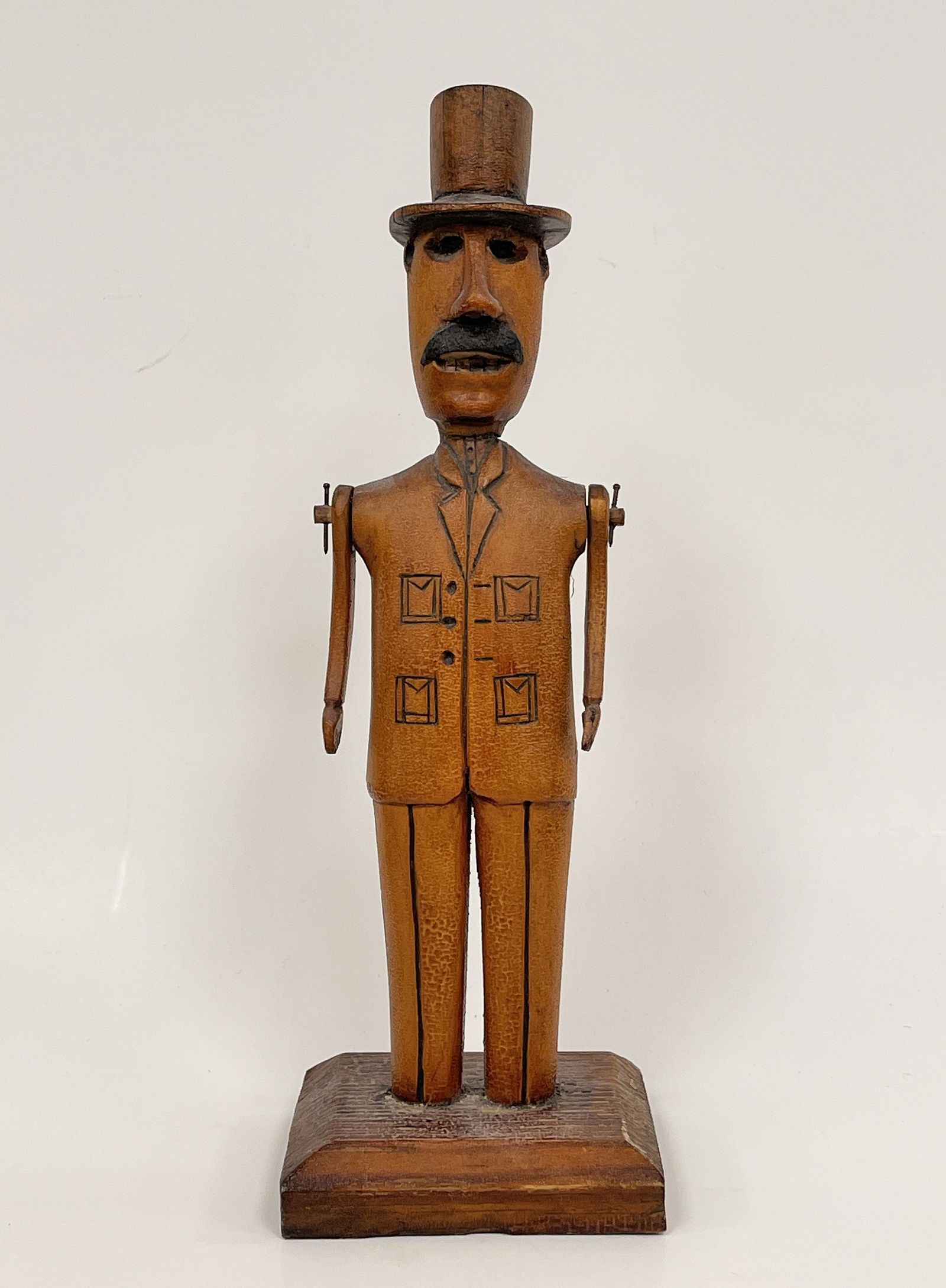 MAN IN TOPHAT CARVING: MAN IN TOPHAT CARVING Mustached men in suit with top hat, full body carving, original surfaces, articulated arms, late 19th C , excellent condition.