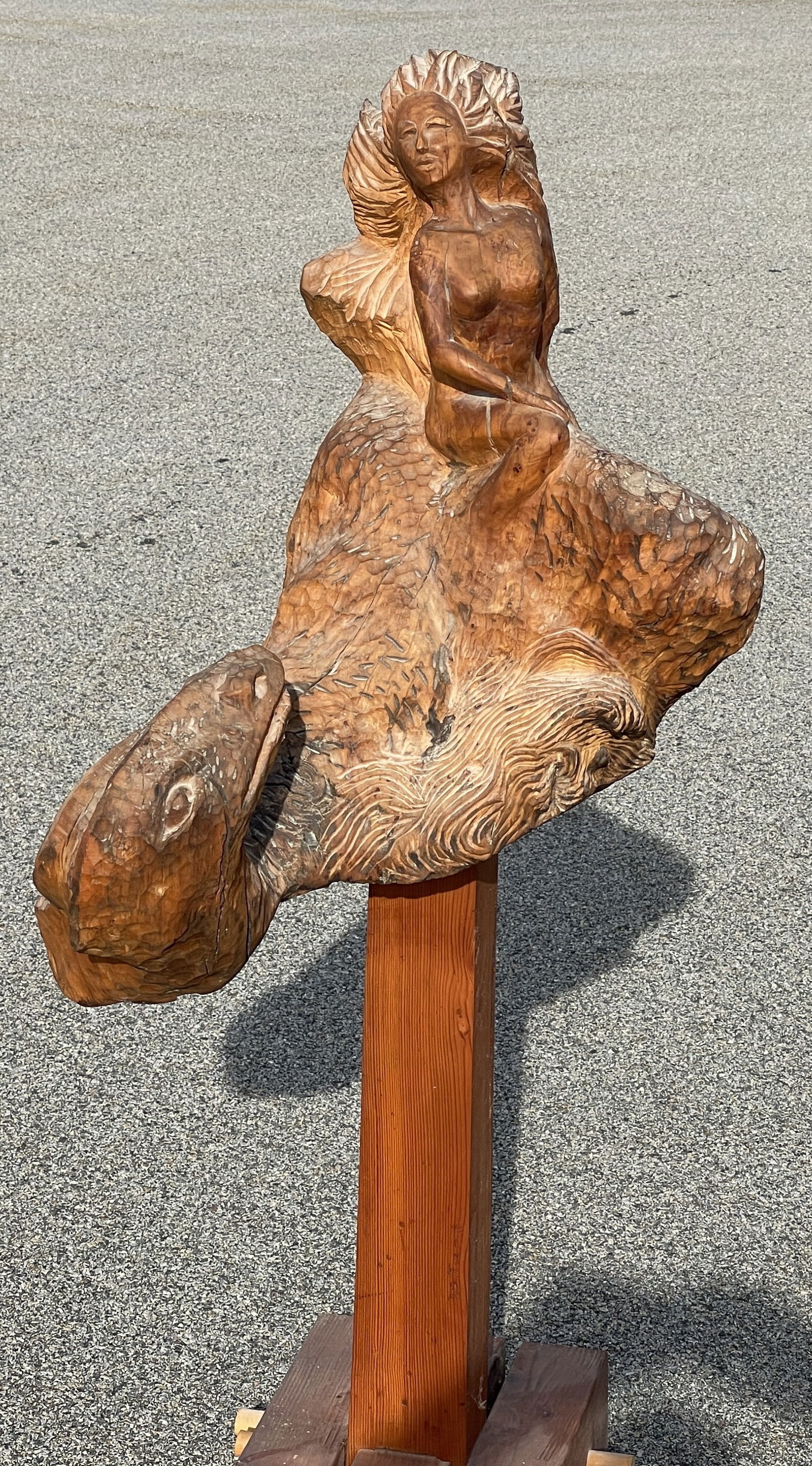 CARVED MERMAID WITH SERPENT: CARVED MERMAID WITH SERPENT Carved from a single block, full bodied, mounted on stand, original surfaces.