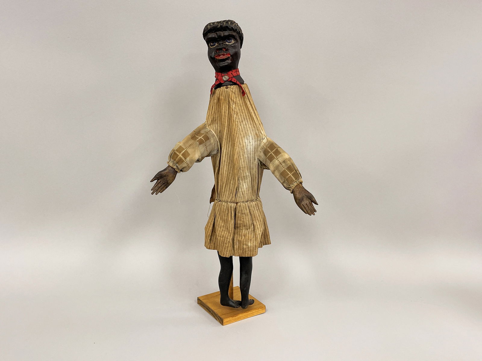 BLACK DOLL, CARVED HEAD: BLACK DOLL, CARVED HEAD Fabric stuffed, carved & painted head & hands, late 19th – early 20th C.