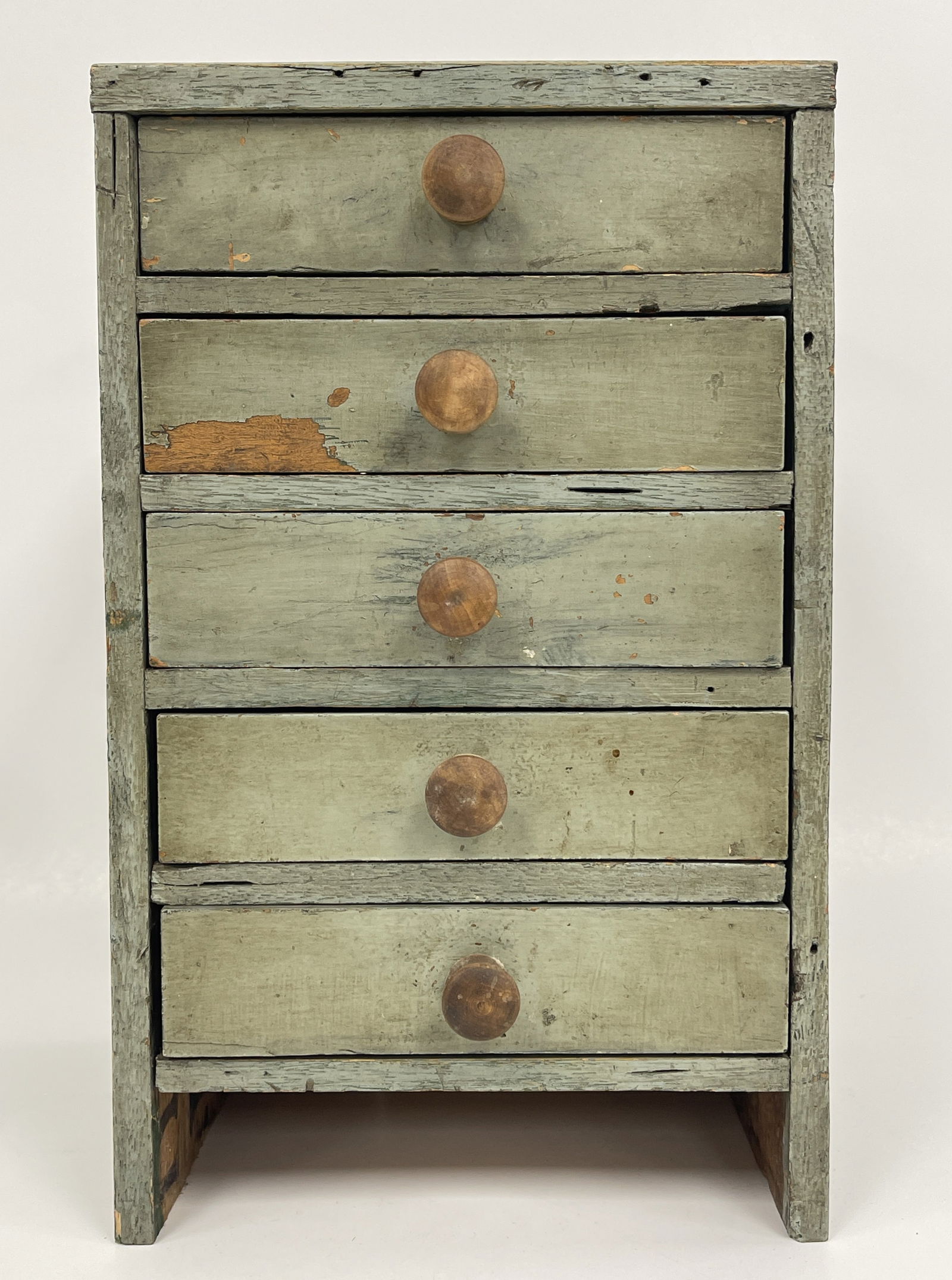 MINIATURE CHEST OF DRAWERS: MINIATURE CHEST OF DRAWERS Original green paint, walnut, dovetailed drawers, square nailed, VG condition.