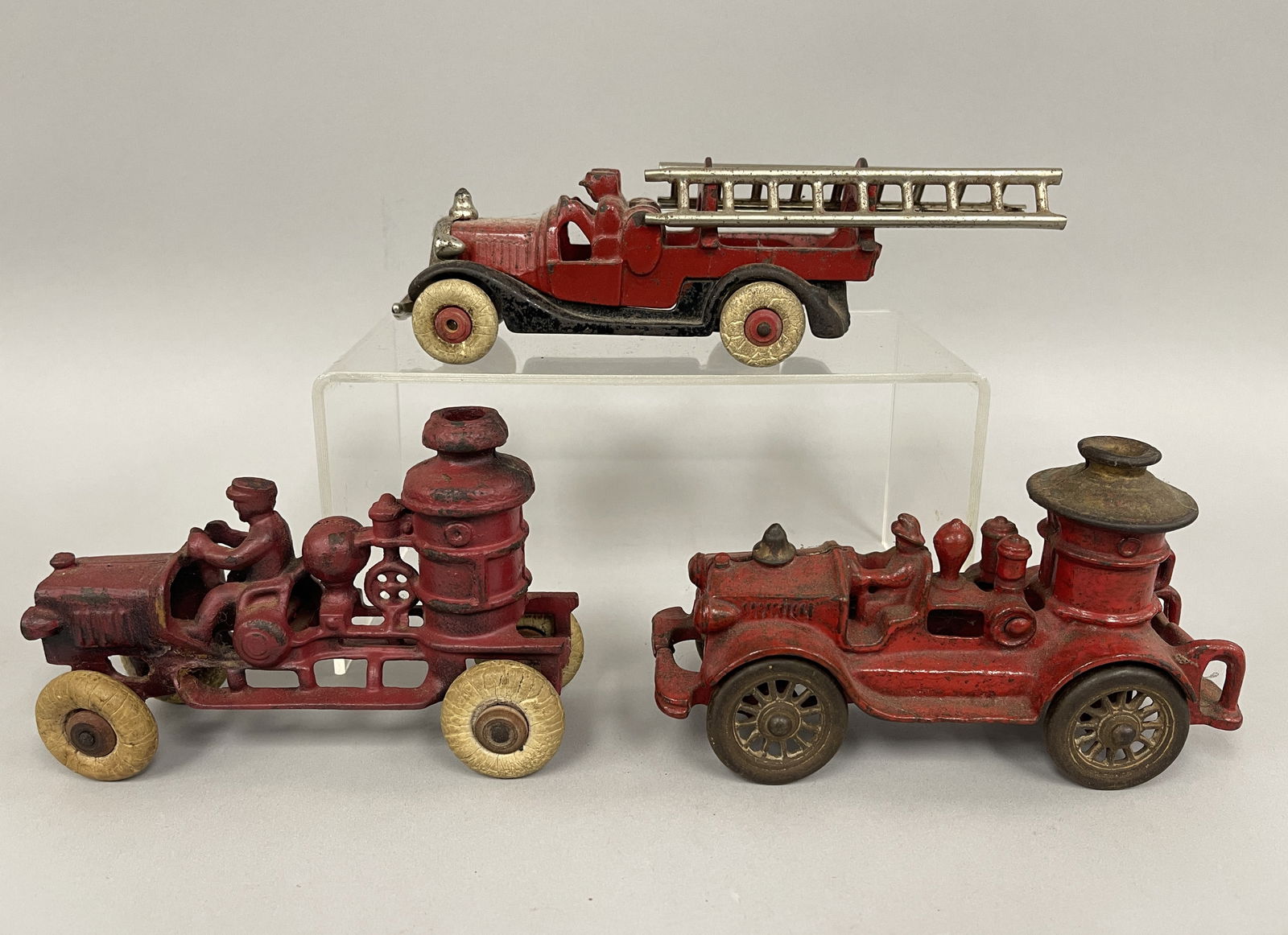 FIRE TRUCK TOYS: FIRE TRUCK TOYS Lot of four, original paint, cast metal, late 19th C, excellent condition.