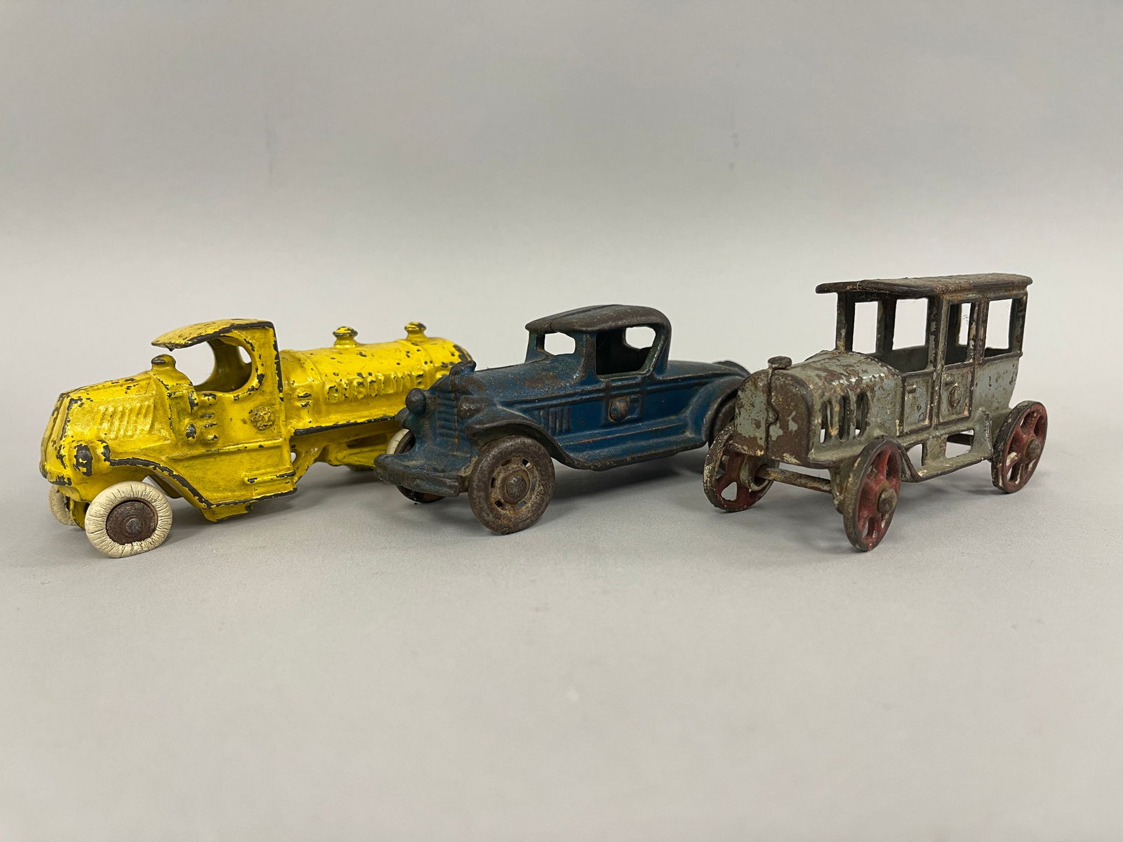 TOY TRUCKS & CAR: TOY TRUCKS & CAR Original paint, cast metal, late 19th C, excellent condition.