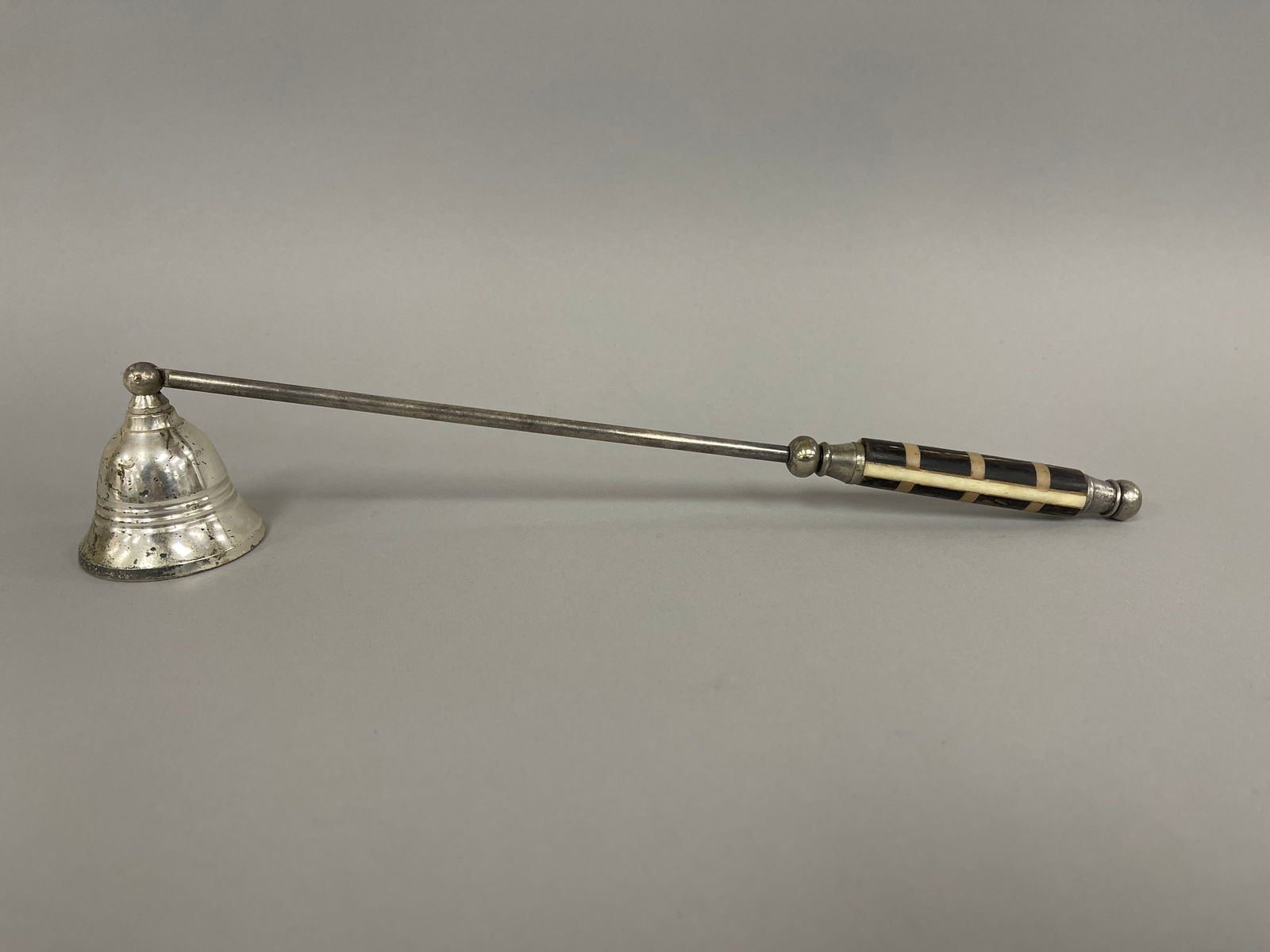 SILVERED CANDLE SNUFFER: SILVERED CANDLE SNUFFER Bone inlaid handle, 19th C, excellent condition.