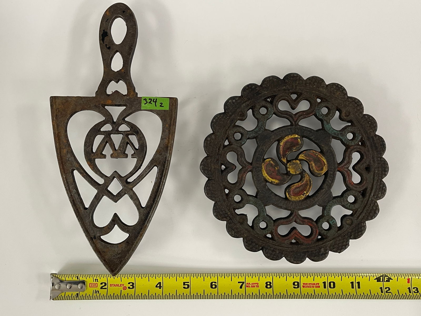 TWO EARLY IRON TRIVETS - 2