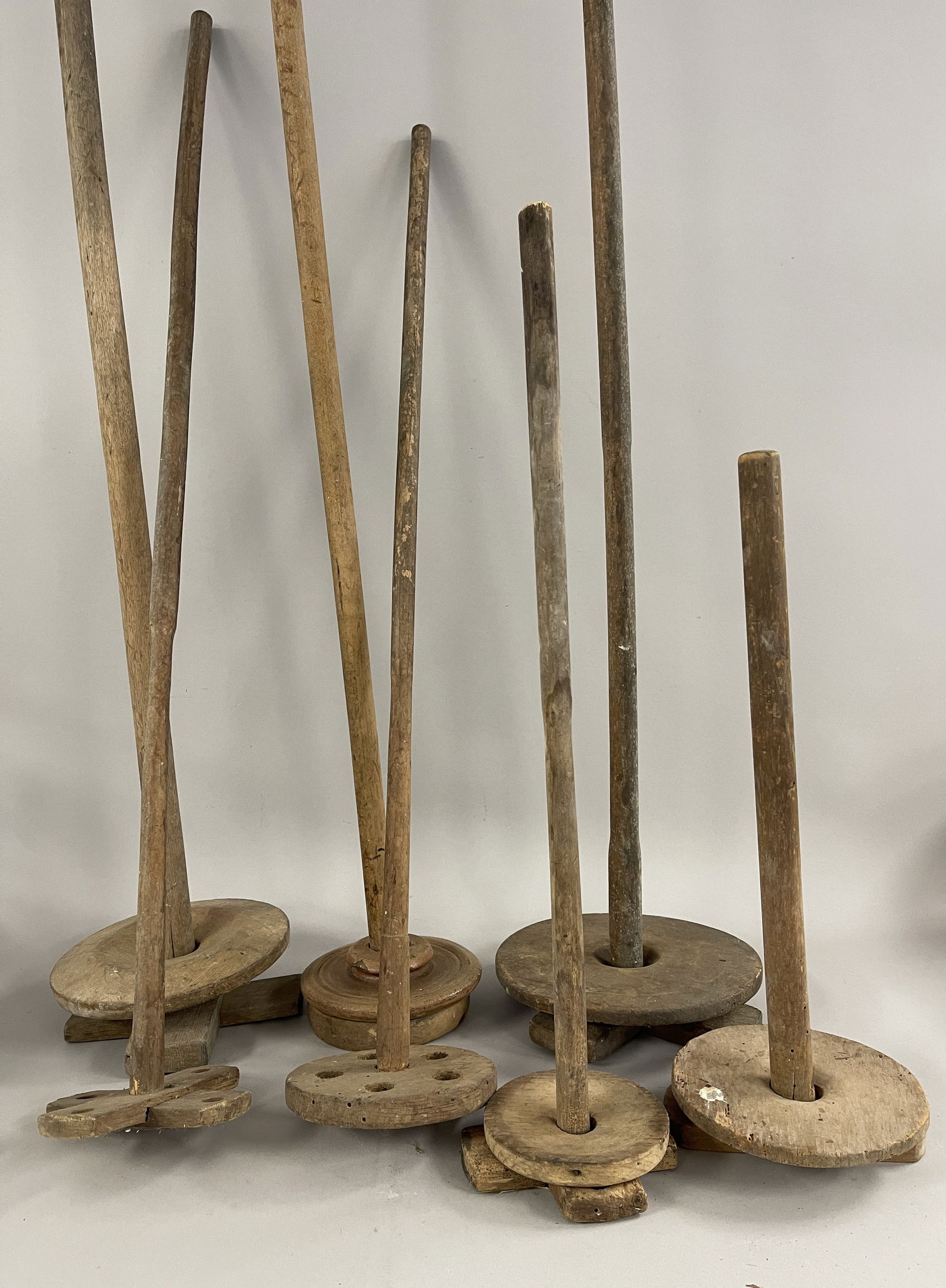 LOT OF SEVEN EARLY WOODEN BUTTER PLUNGERS (1 of 4)