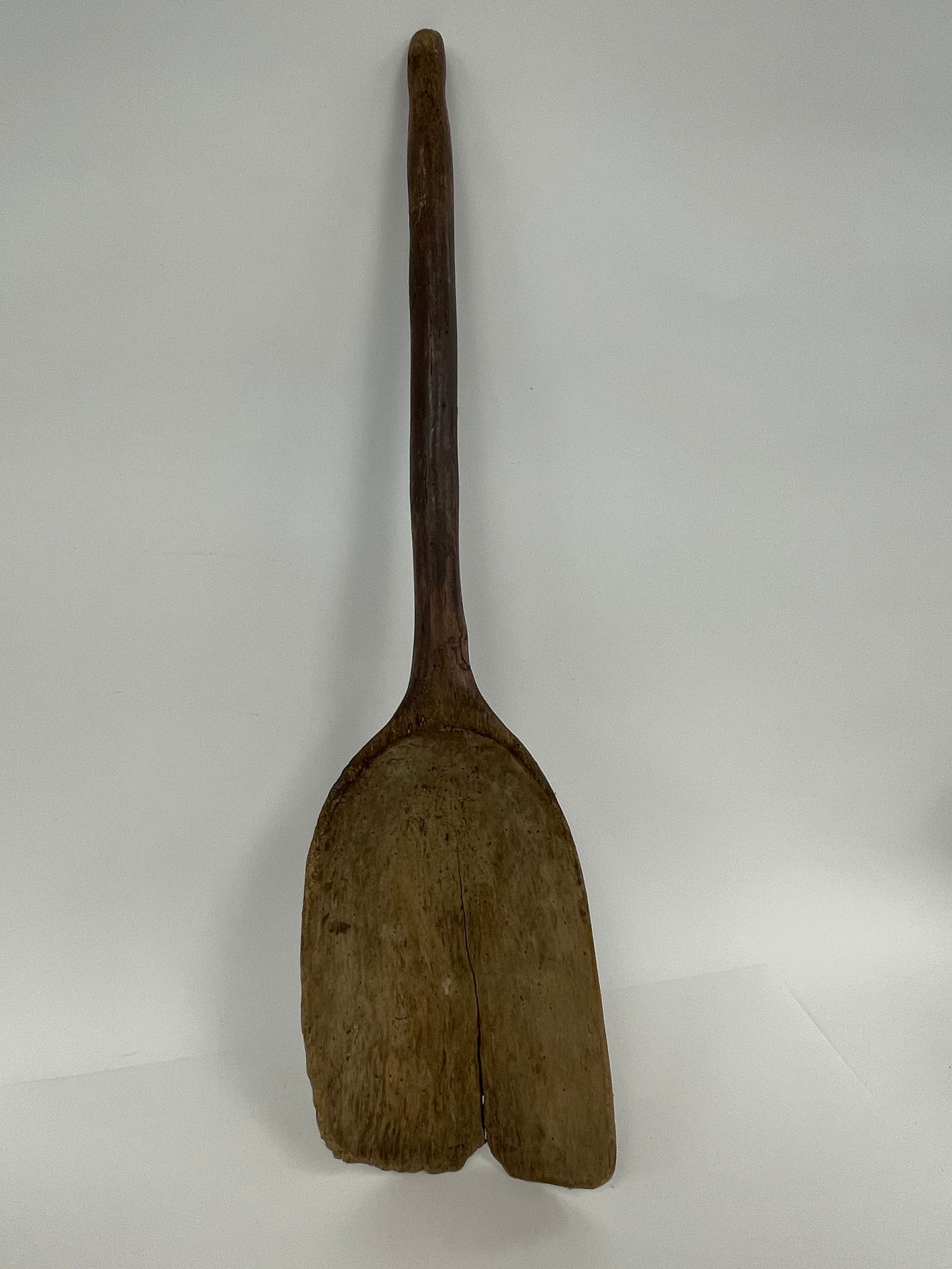 wooden grain shovel in remnants of early red paint (1 of 2)