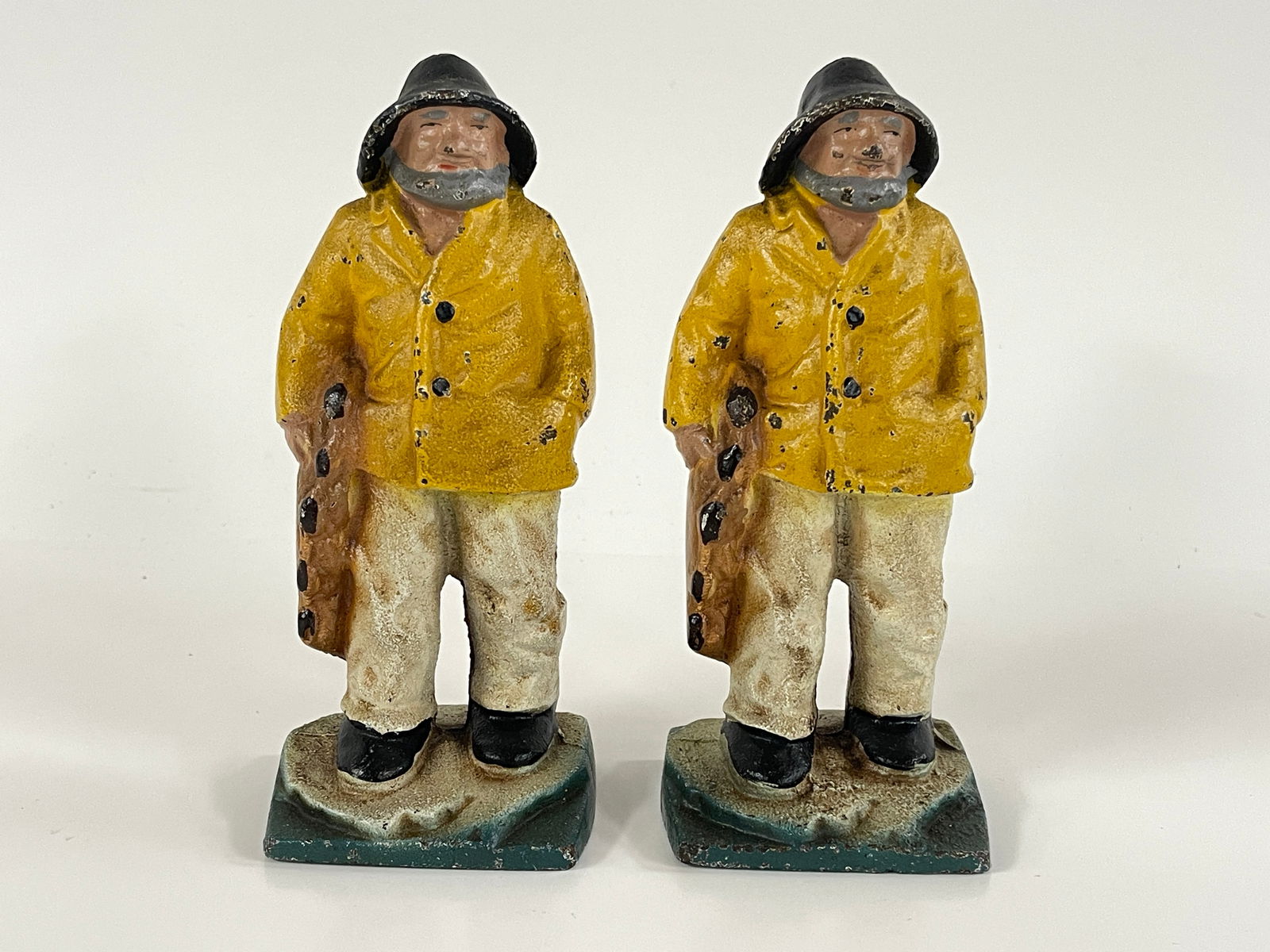 PAIR OF CAST IRON PAINTED FISHERMAN DOORSTOPS (1 of 3)