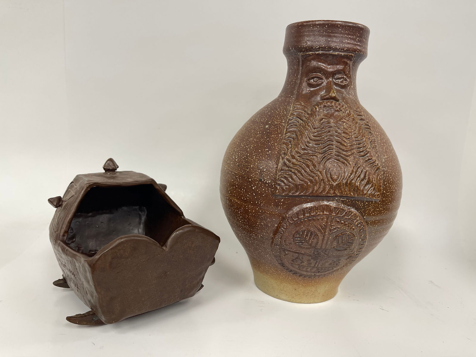 TWO PIECE REPRO POTTERY BELLARMINE JUG, CRADLE: TWO PIECE REPRO POTTERY BELLARMINE JUG, CRADLE