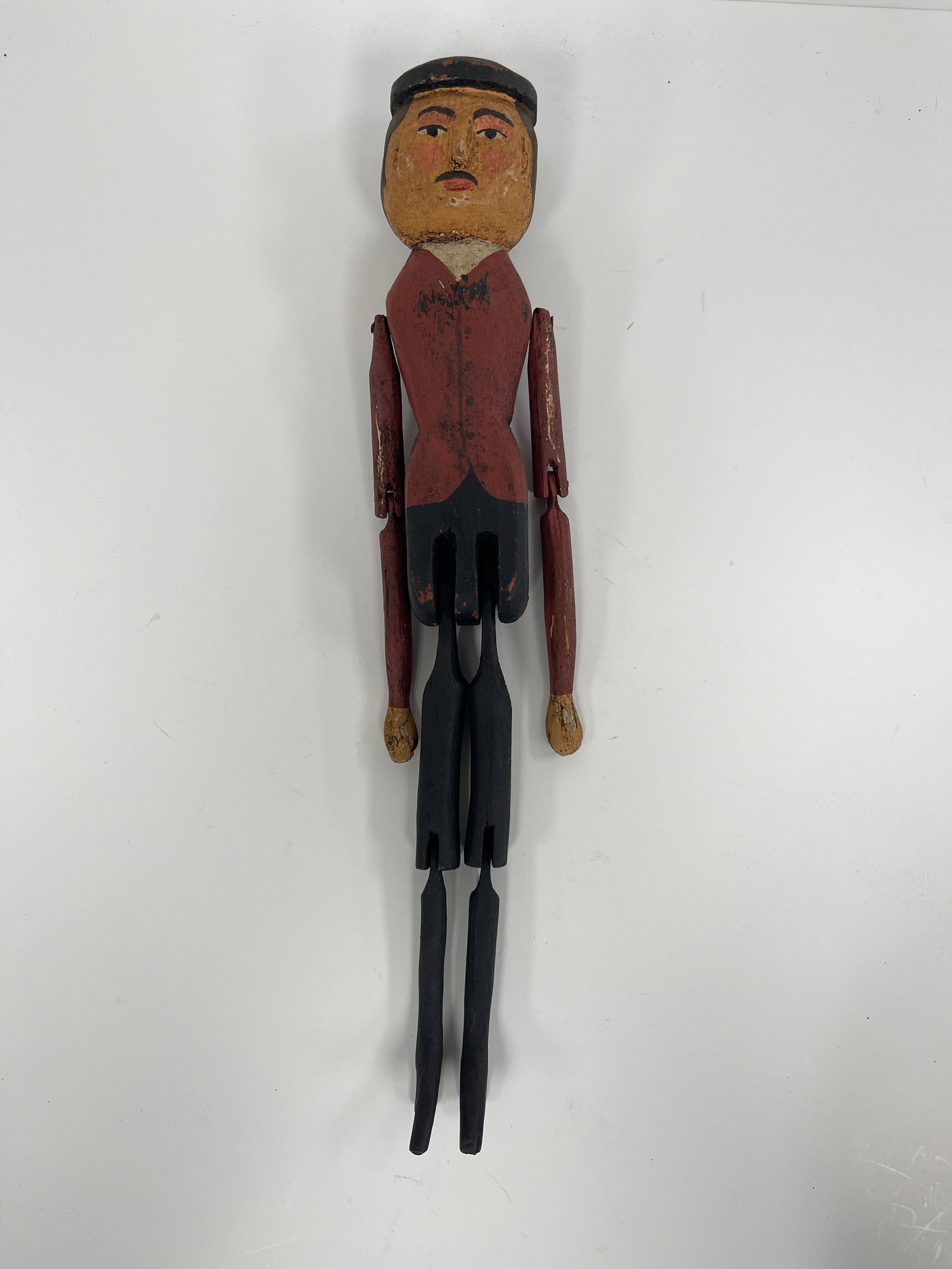 CARVED WOOD PENNY DOLL: CARVED WOOD PENNY DOLL OF A "MAN IN BLACK BERET" W/ RED JACKET &BLACK LEGS