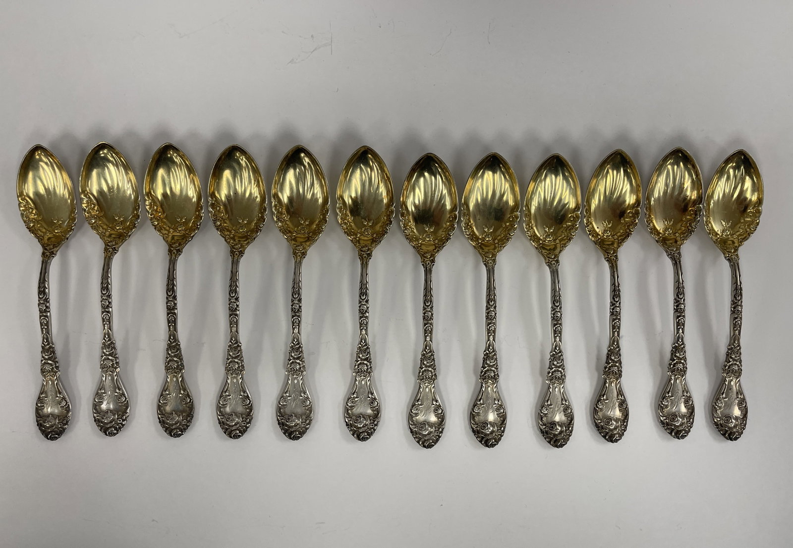 SET 12 STERLING SILVER SPOONS: SET 12 STERLING SILVER SPOONS WITH GOLD WASH BOWLS THEODORE R STARR 322 GR
