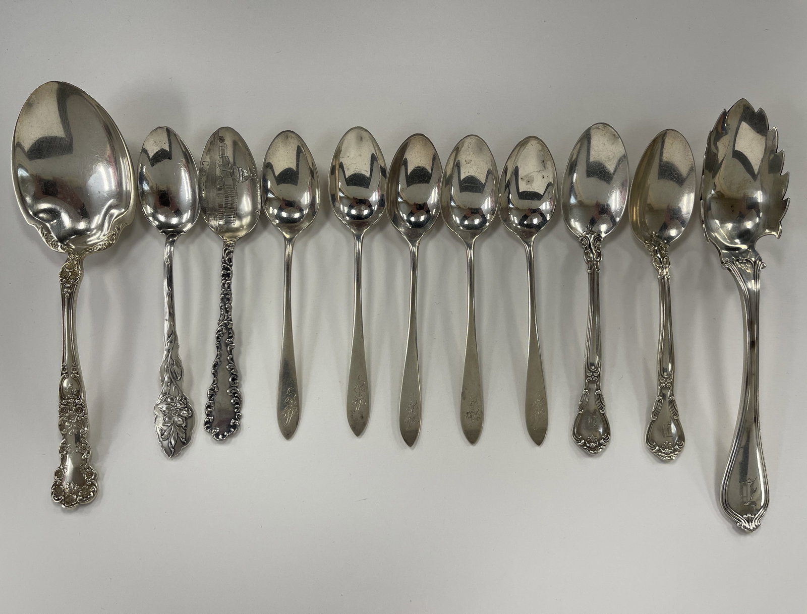 10 STERLING SILVER SPOONS,1 CHEESE SCOOP: 10 STERLING SILVER SPOONS,1 CHEESE SCOOP ALL MARKED STERLING 223 GR