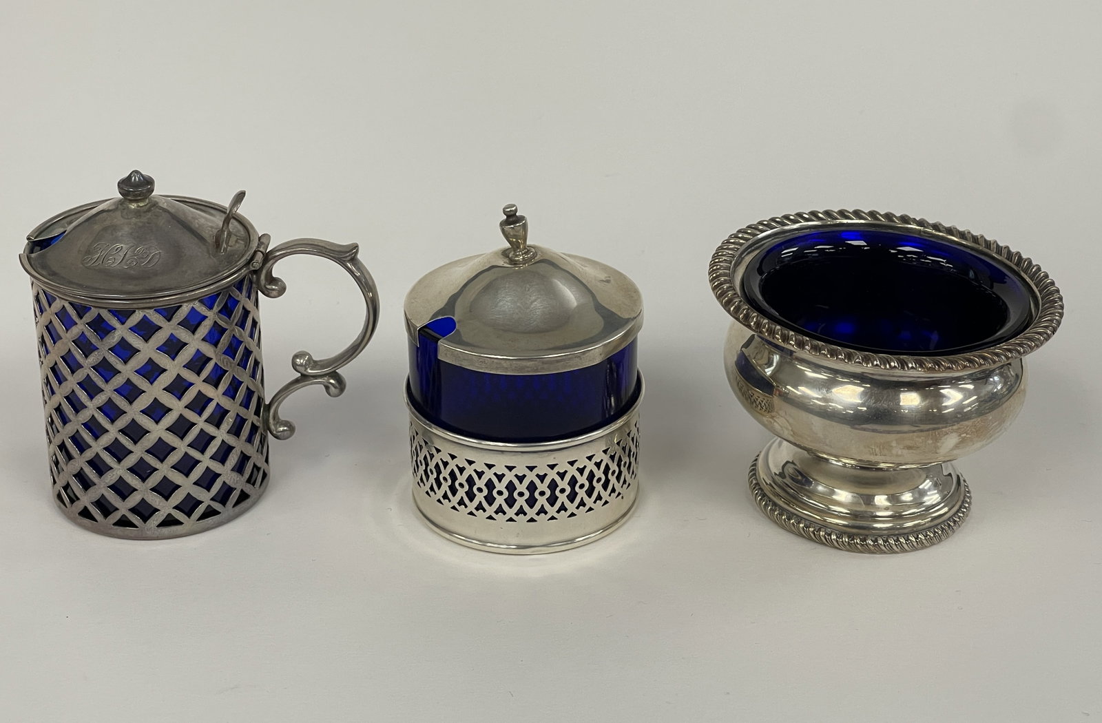 THREE SMALL MUSTARD AND CONDIMENT POTS: THREE SMALL MUSTARD AND CONDIMENT POTS COBALT GLASS LINERS BOWL MARKED ENGLAND 1164