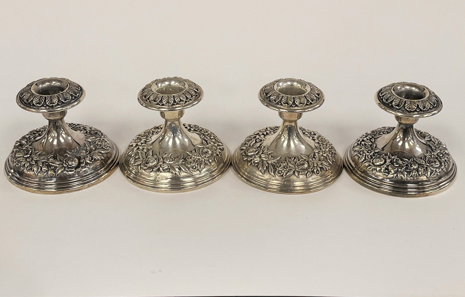 FOUR STERLING SILVER CANDLESTICKS (1 of 4)