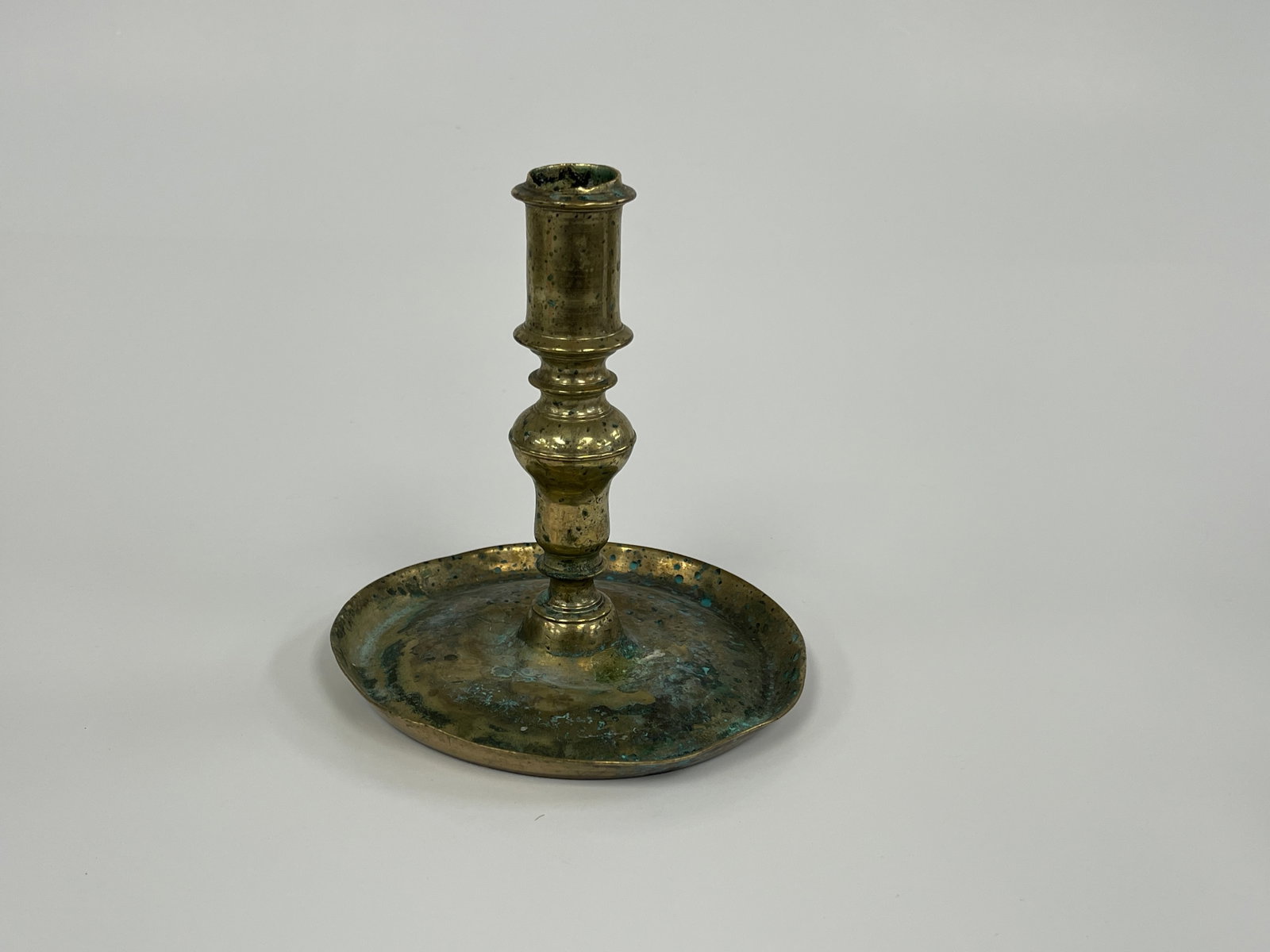 17TH C BRASS SAUCER BASE CANDLESTICK (1 of 4)