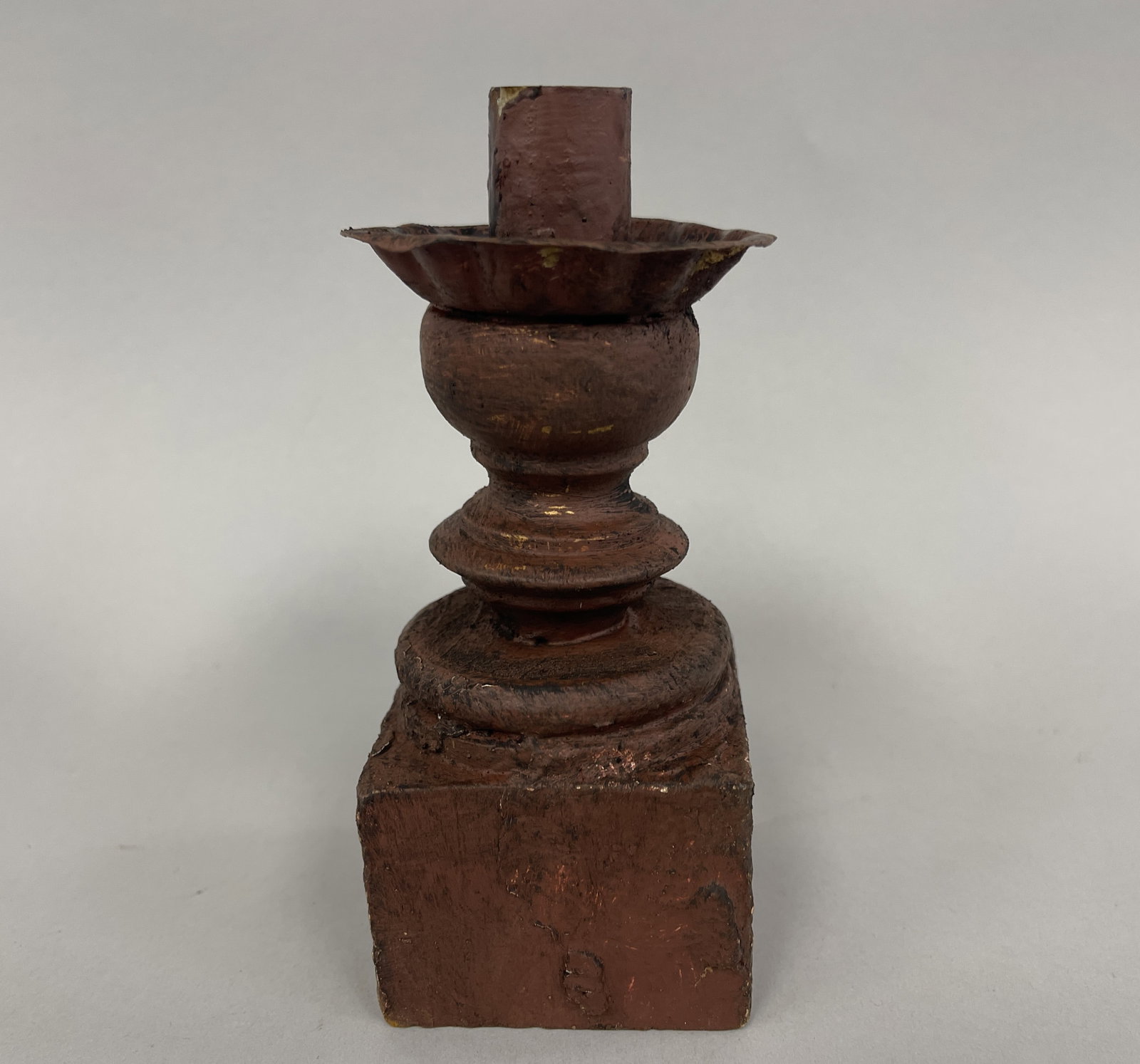 SMALL RED CHAMBER STICK W/ WOODEN BASE: SMALL RED CHAMBER STICK W/ WOODEN BASE A7 OLD TIN TOP