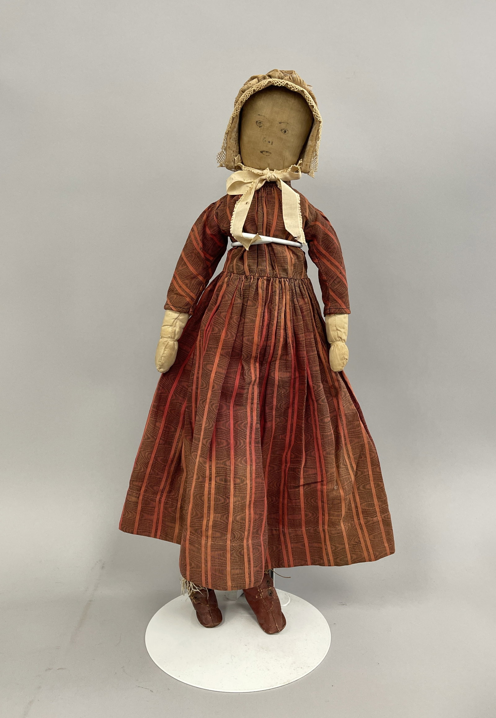 CIRCA 1890 CLOTH DOLL: CIRCA 1890 CLOTH DOLL, INK DRAWN FACE, ORIGINAL RED LEATHER SHOES, 22" TALL