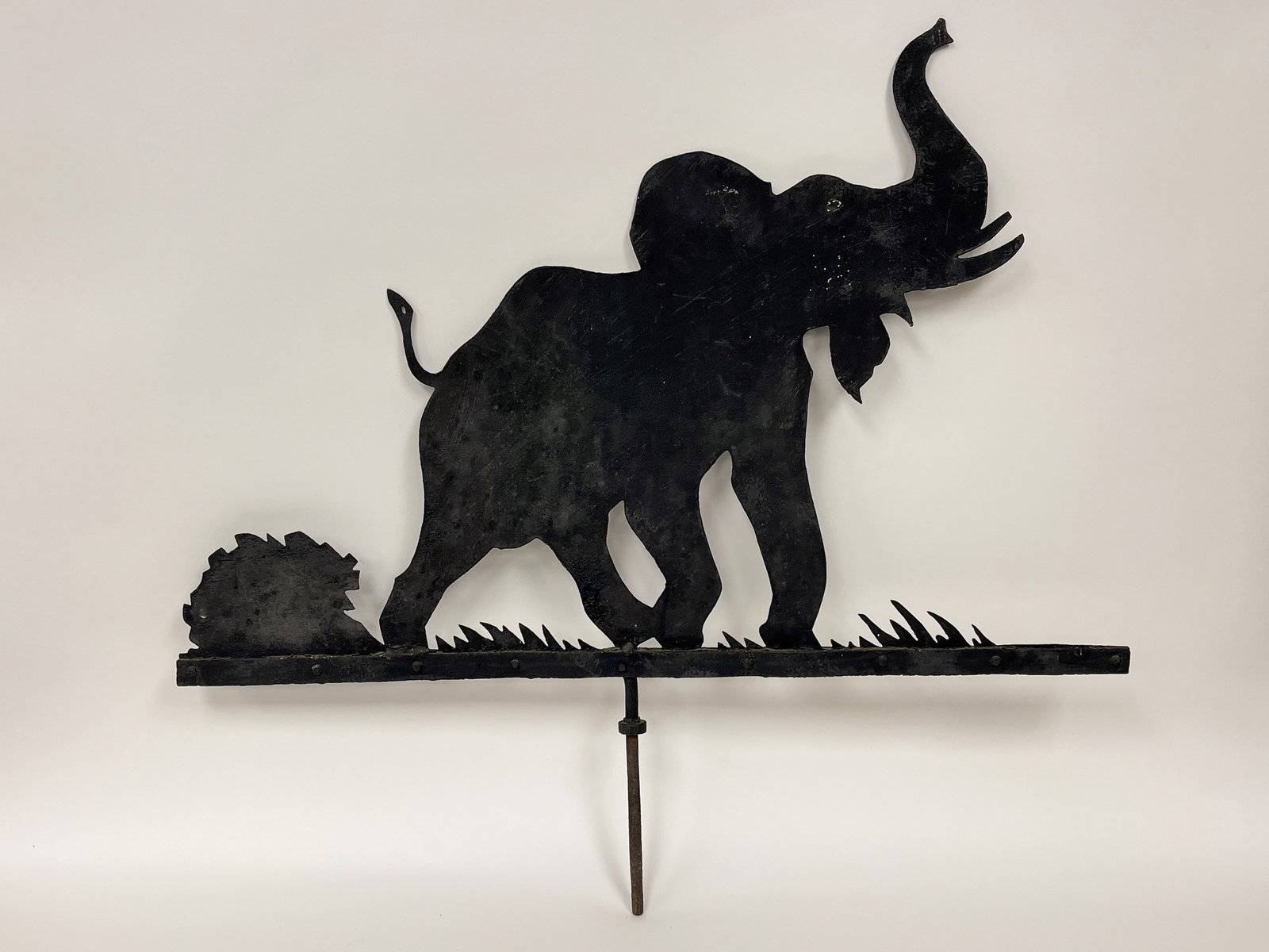 RARE ELEPHANT WEATHERVANE C 1900: RARE ELEPHANT WEATHERVANE C 1900, HEAVY GAUGE SHEET IRON, DEPICTED ON A LANDSCAPE BASE, ORIGINAL MOUNTING RD, EARLY BLACK PAINT, EXCELLENT UNTOUCHED CONDITION 36 X 28T