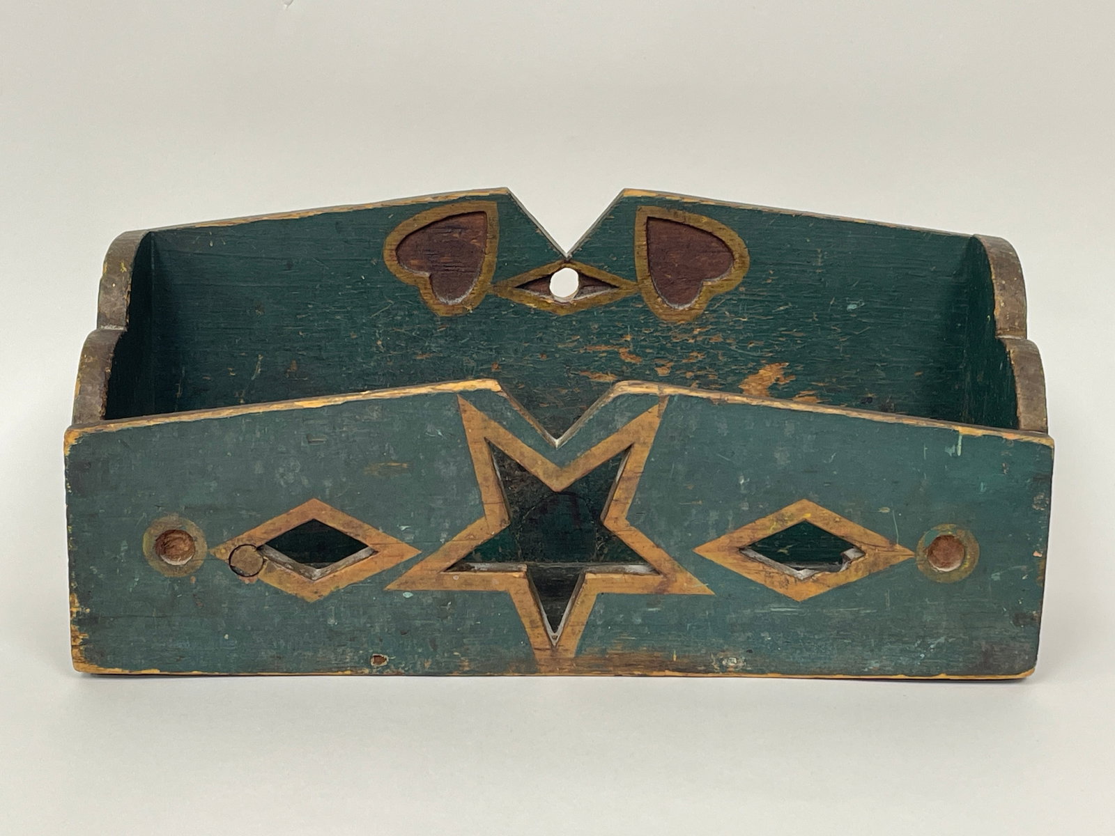 RARE FOLK ART WALLBOX C 1820: RARE FOLK ART WALLBOX C 1820, PINE, ORIGINAL PAINT, RARE PIERCED STAR AND DIAMONDS MOTIF WITH RELIEF CARVED HEARTS AND CIRCLES. EXCELLENT ORIGINAL CONDITION 16 X 5 X 7.5