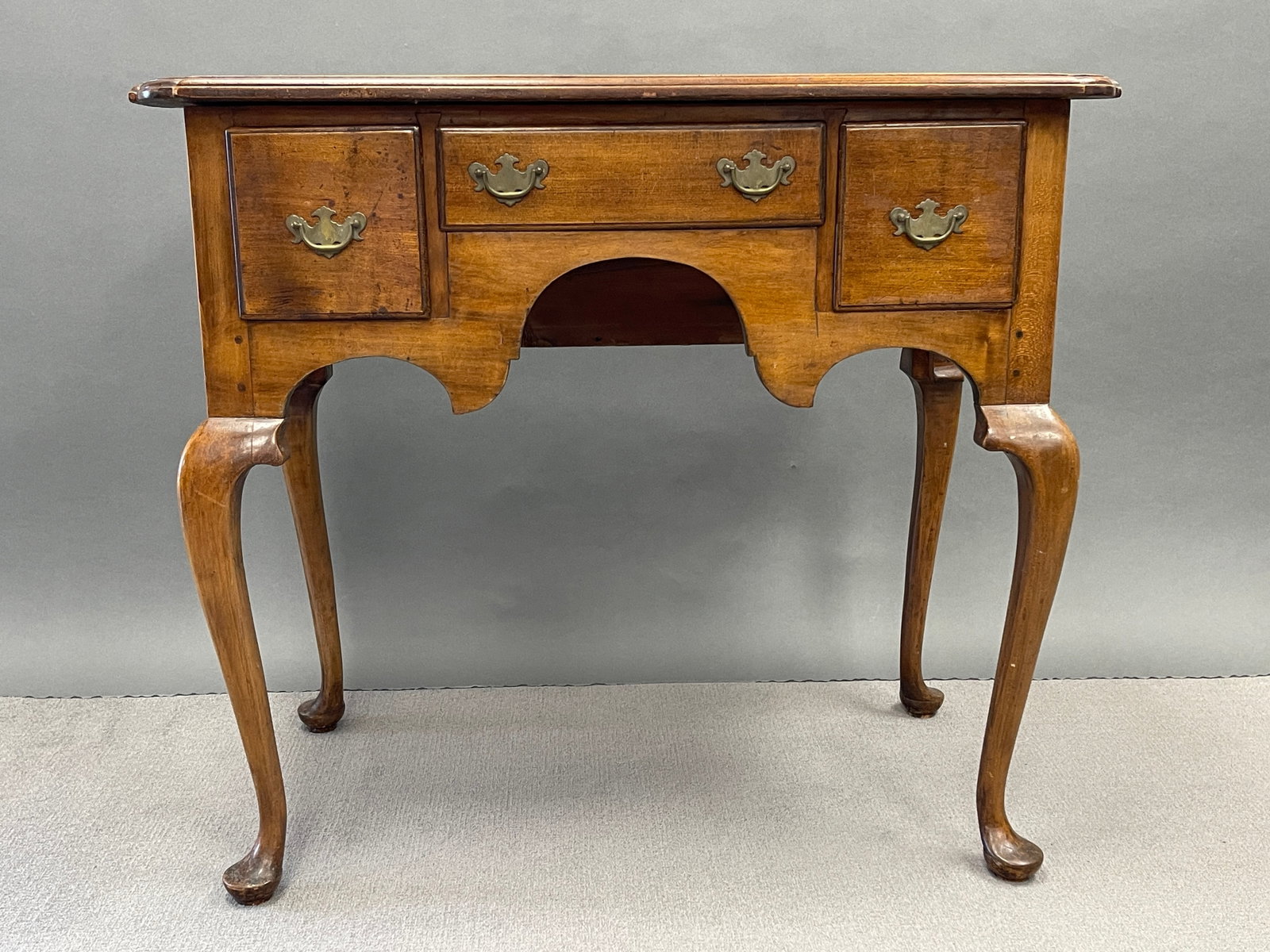 QUEEN ANNE LOWBOY: QUEEN ANNE LOWBOY, MASSACHUSETTS OR NEW HAMPSHIRE, OLD, IF NOT ORIGINAL BRASSES, TOP HAS SEMI-CIRCULAR CORNERS ON FRONT, SLIGHT CUPPING TO TOP