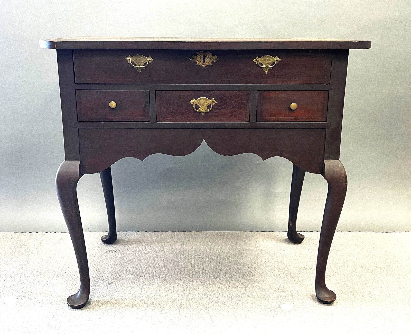 EASTERN MASSACHUSETTS LOWBOY: EASTERN MASSACHUSETTS, PROBABLY BOSTON LOWBOY, IN AN OLD DARK ALLIGATORED FINISH, LINE INLAY ON DRAWERS, SHAPED TOP, OLD, POSSIBLY ORIGINAL ENGRAVED BRASSES, RESTORED