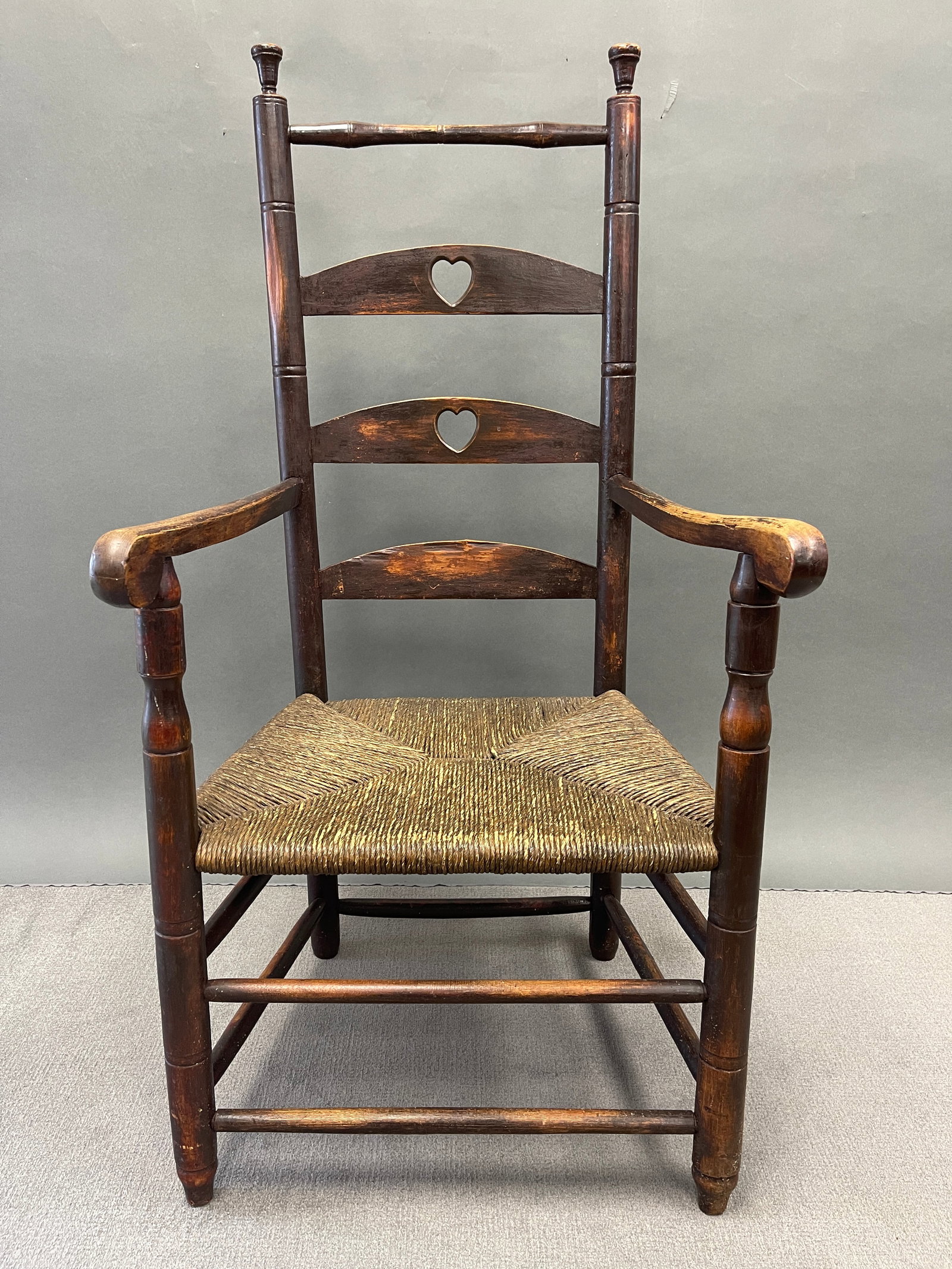 TOP RAIL LADDER BACK ARMCHAIR WITH HEART CUTOUTS (1 of 6)