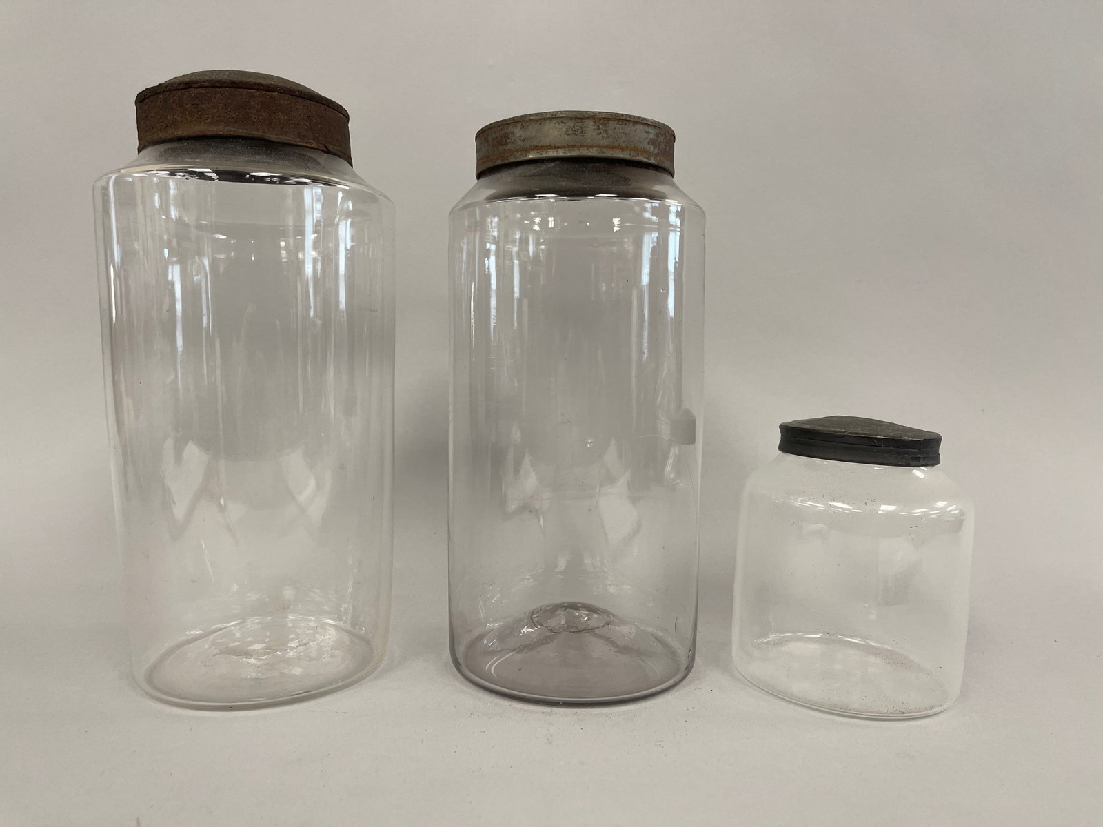 THREE GLASS APOTHECARY JARS (1 of 2)