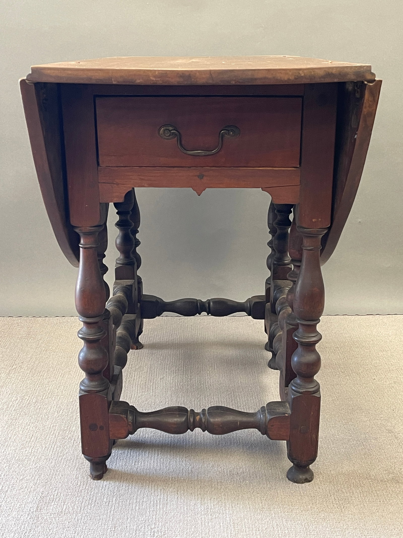 BOLDLY TURNED WALNUT GATELEG TABLE - 2