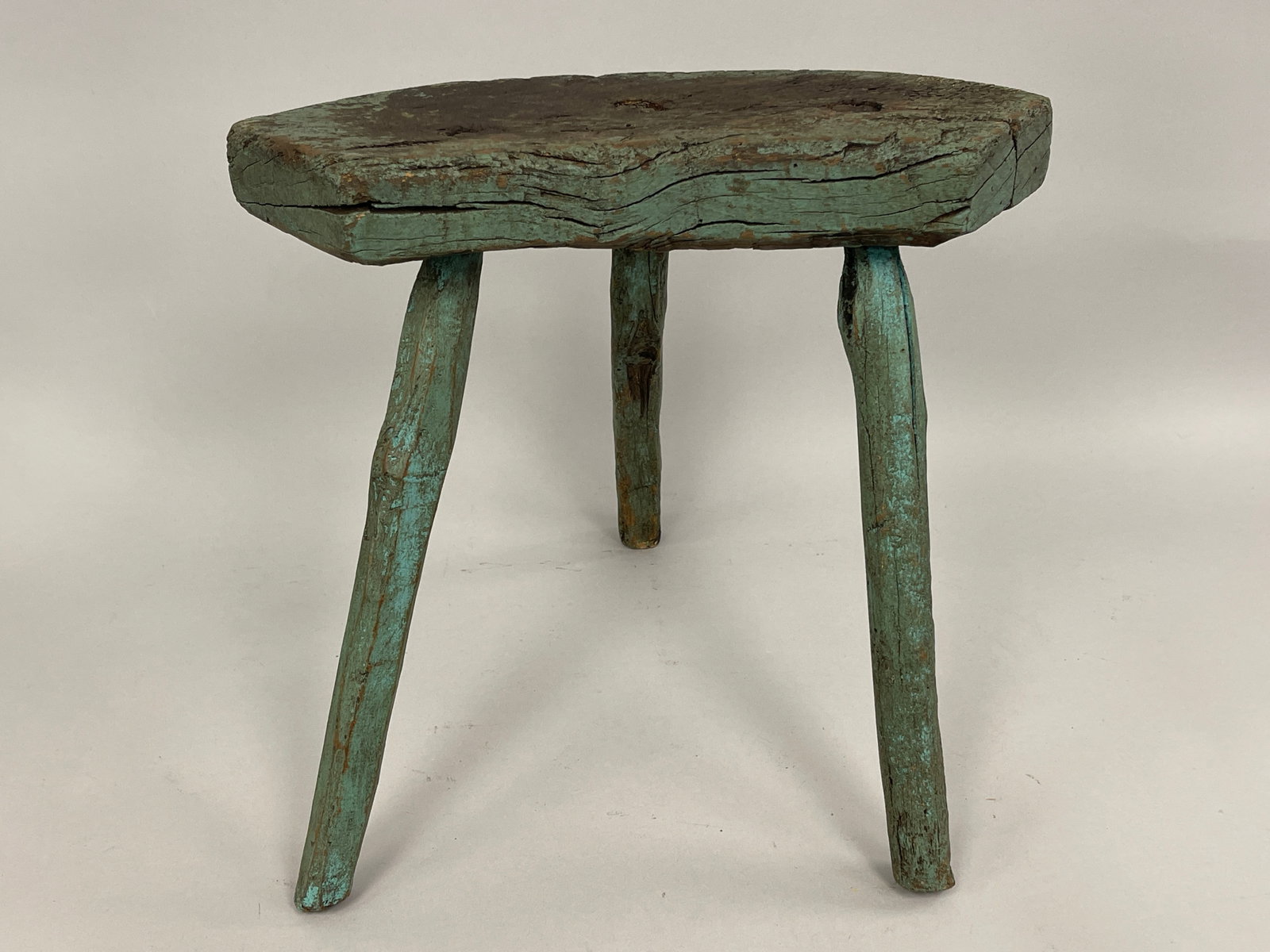 CRESCENT SHAPED TRIFID LEGGED EARLY MILKING STOOL: CRESCENT SHAPED TRIFID LEGGED EARLY MILKING STOOL IN OLD WORN LOVELY COLOR