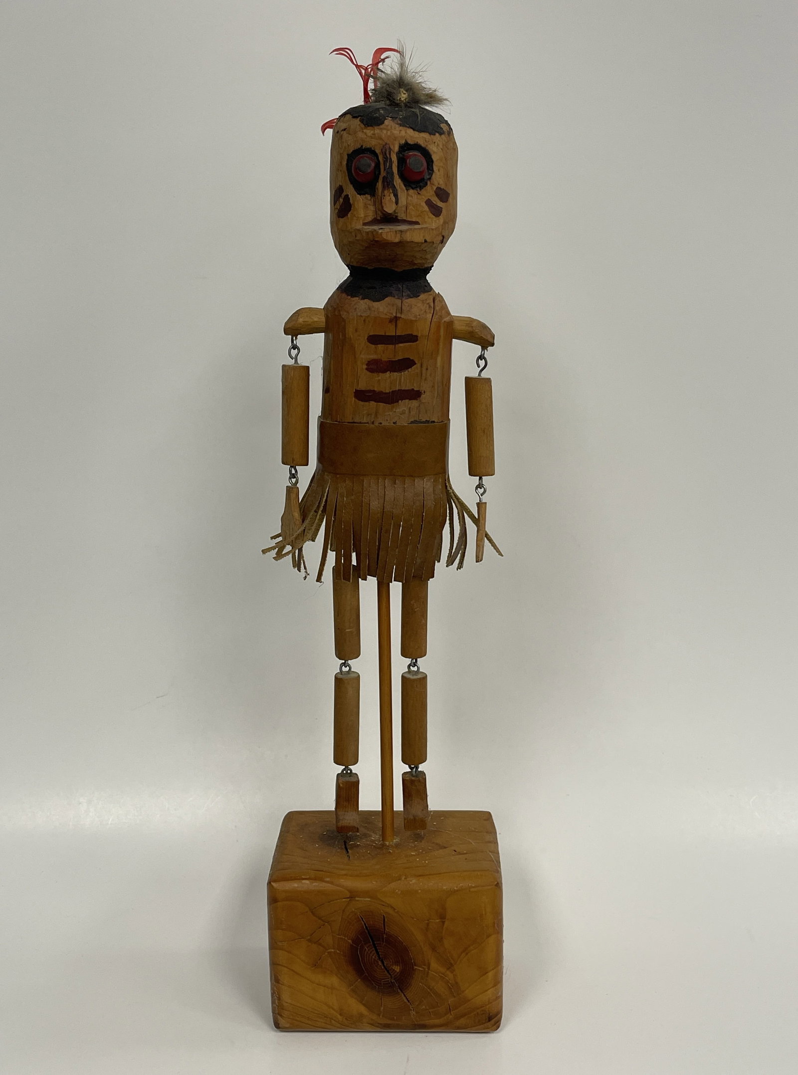 DANCING INDIAN TOY: DANCING INDIAN TOY ORIGINAL SURFACES, PINE WITH LEATHER FRINGE SKIRT, ARTICULATED LIMBS, EARLY 20TH C, EXCELLENT CONDITION.